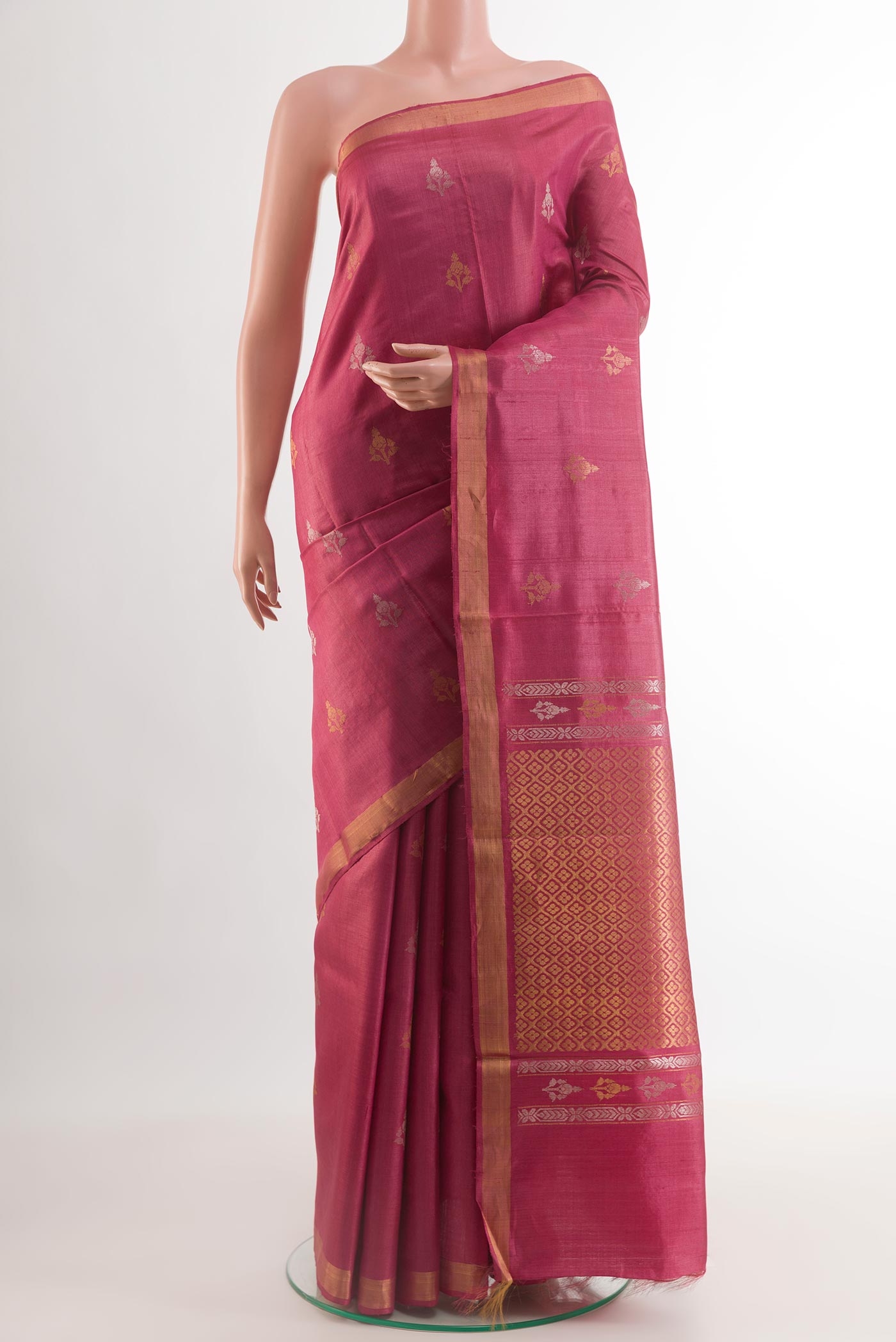 Dark Pink Tussar Silk Saree with Zari Butta on the body and Zari Border.  displayed on a mannequin