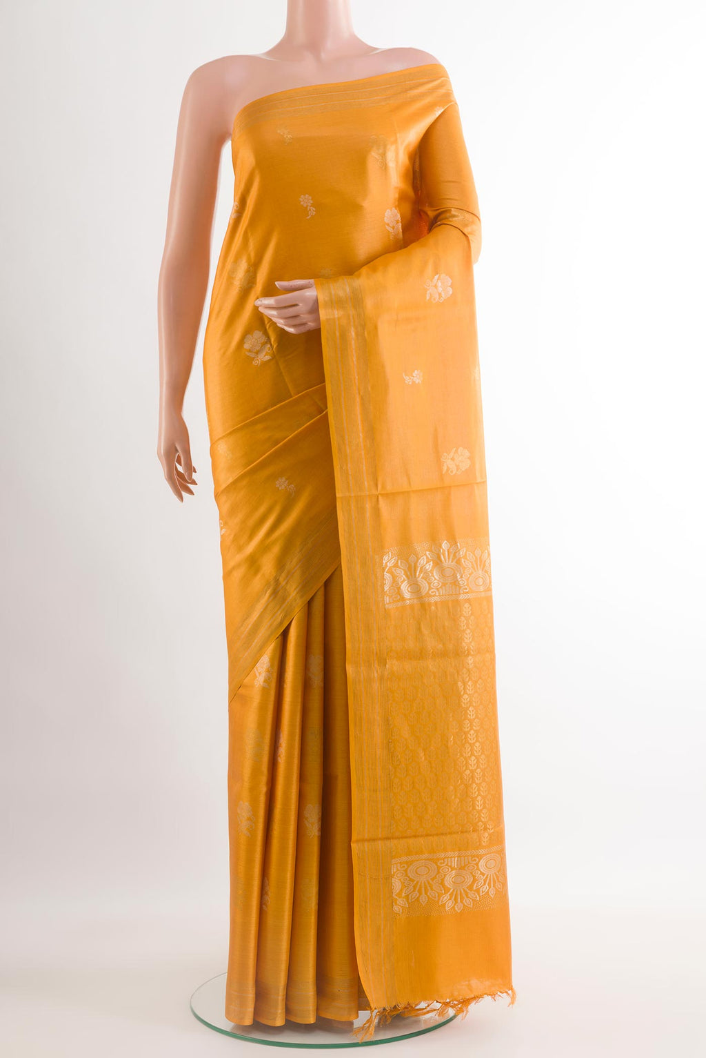 Yellow Tussar Silk Saree with Zari Butta on the body and Zari Border.  displayed on a mannequin