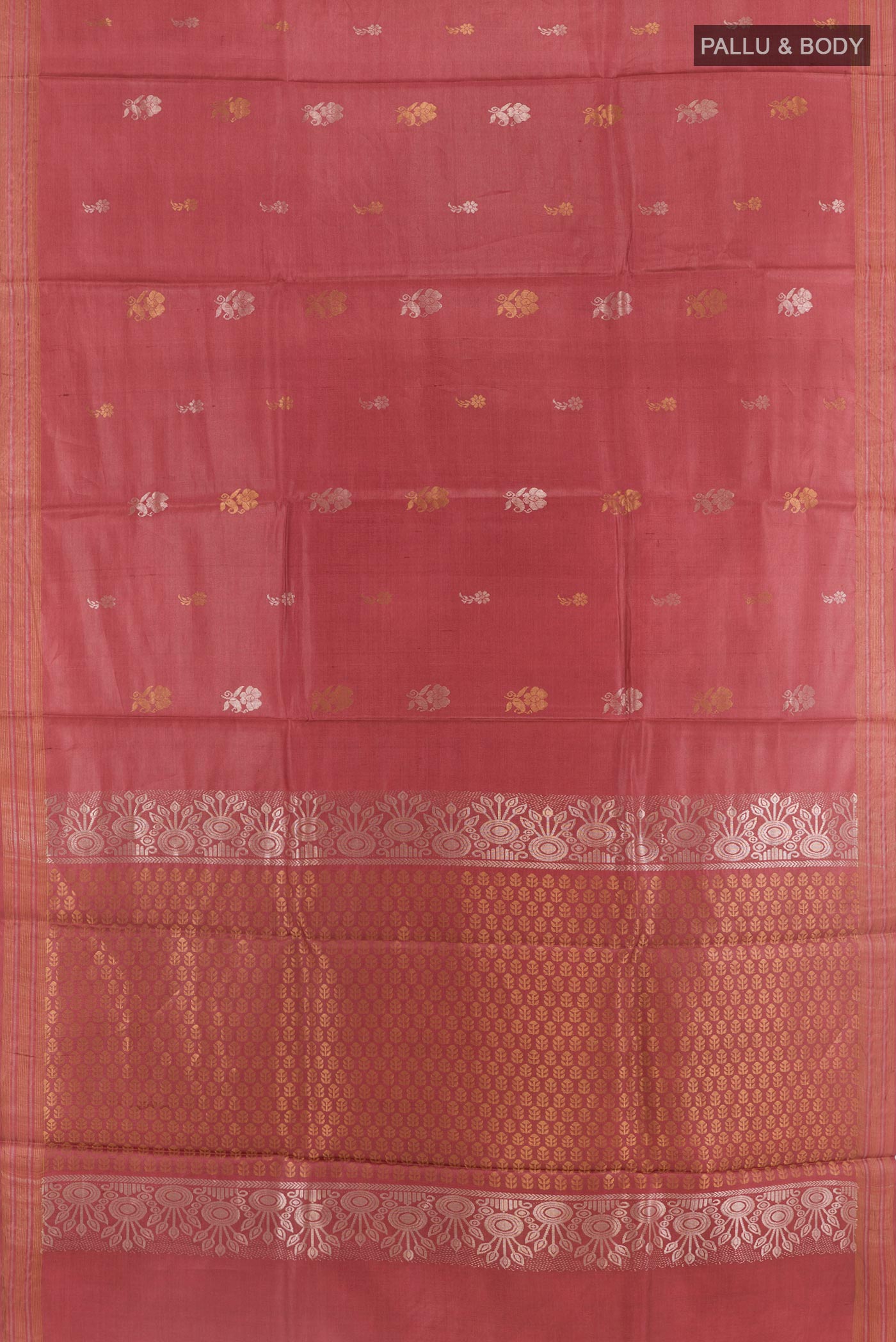 Flat view of Rust Tussar Silk Saree with Zari Butta on the body and Zari Border. 