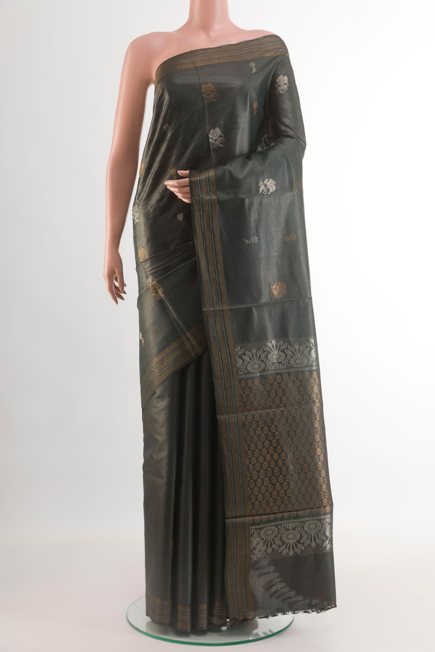 Davys Grey Tussar Silk Saree with Zari Butta on the body and Zari Border.  displayed on a mannequin