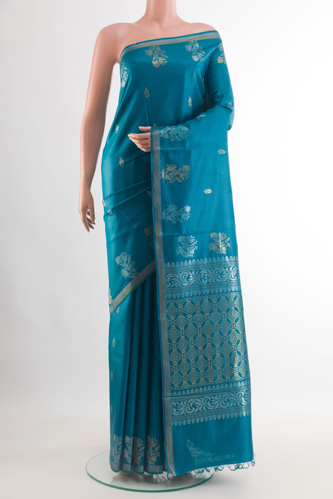 Blue Tussar Saree with Zari Butta on the body and Zari Border.  displayed on a mannequin