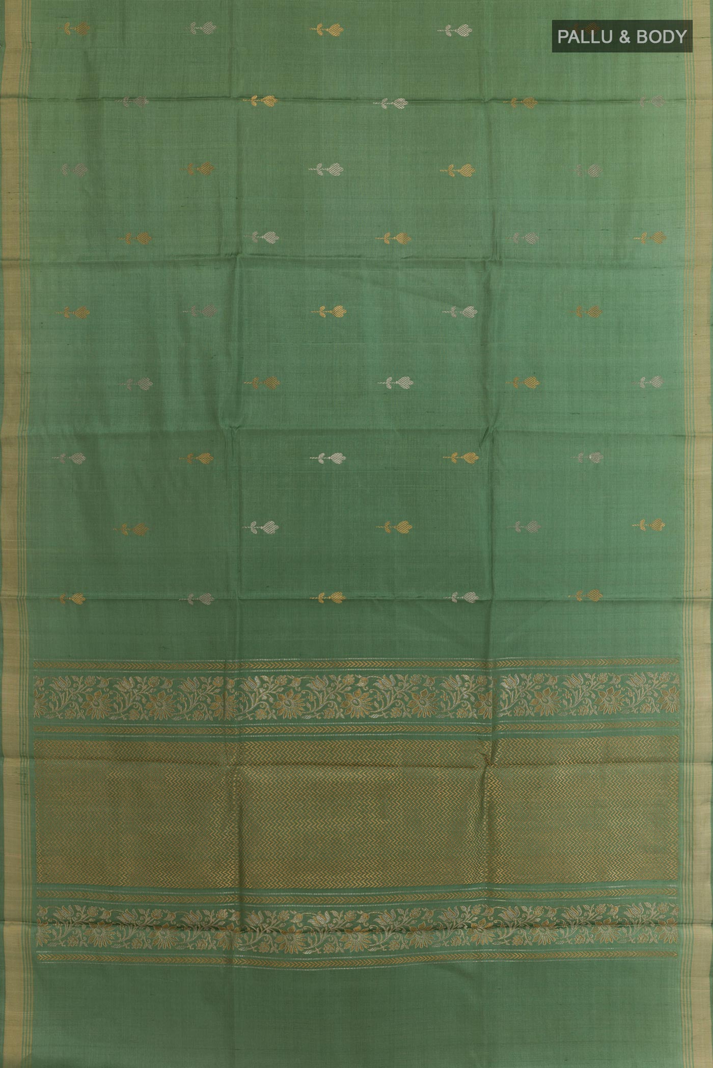 Flat view of Sage Green Tussar Silk Saree with Zari Butta on the body and Zari Border. 