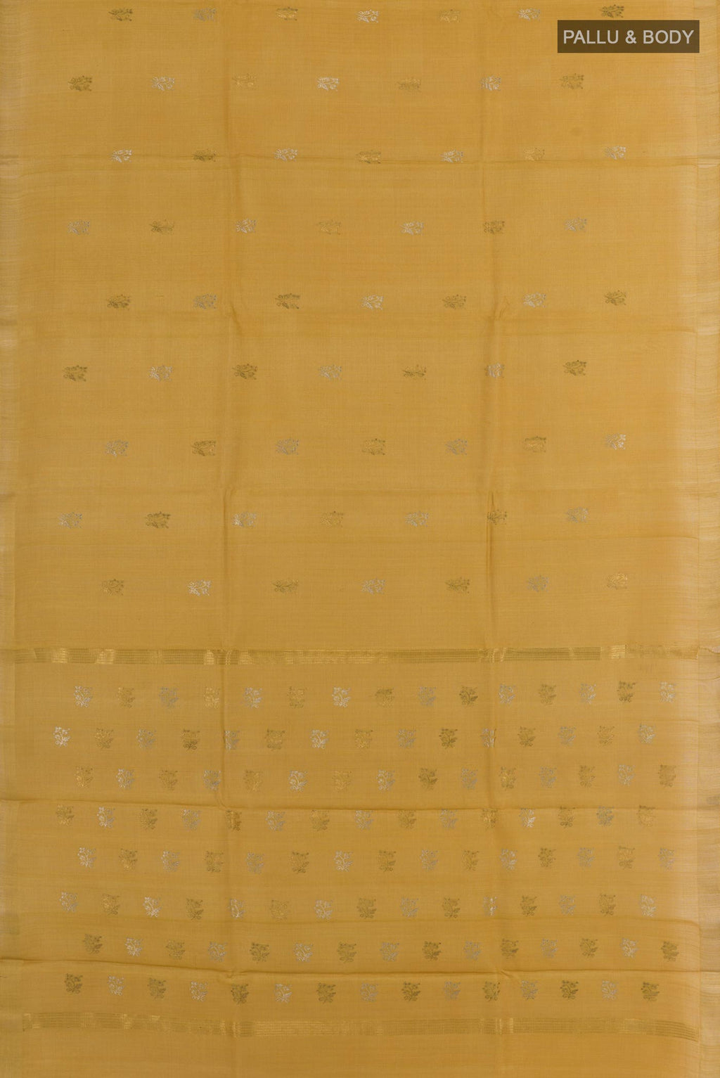 Flat view of Mustard Tussar Silk Saree with Zari Butta on the body and Zari Border. 