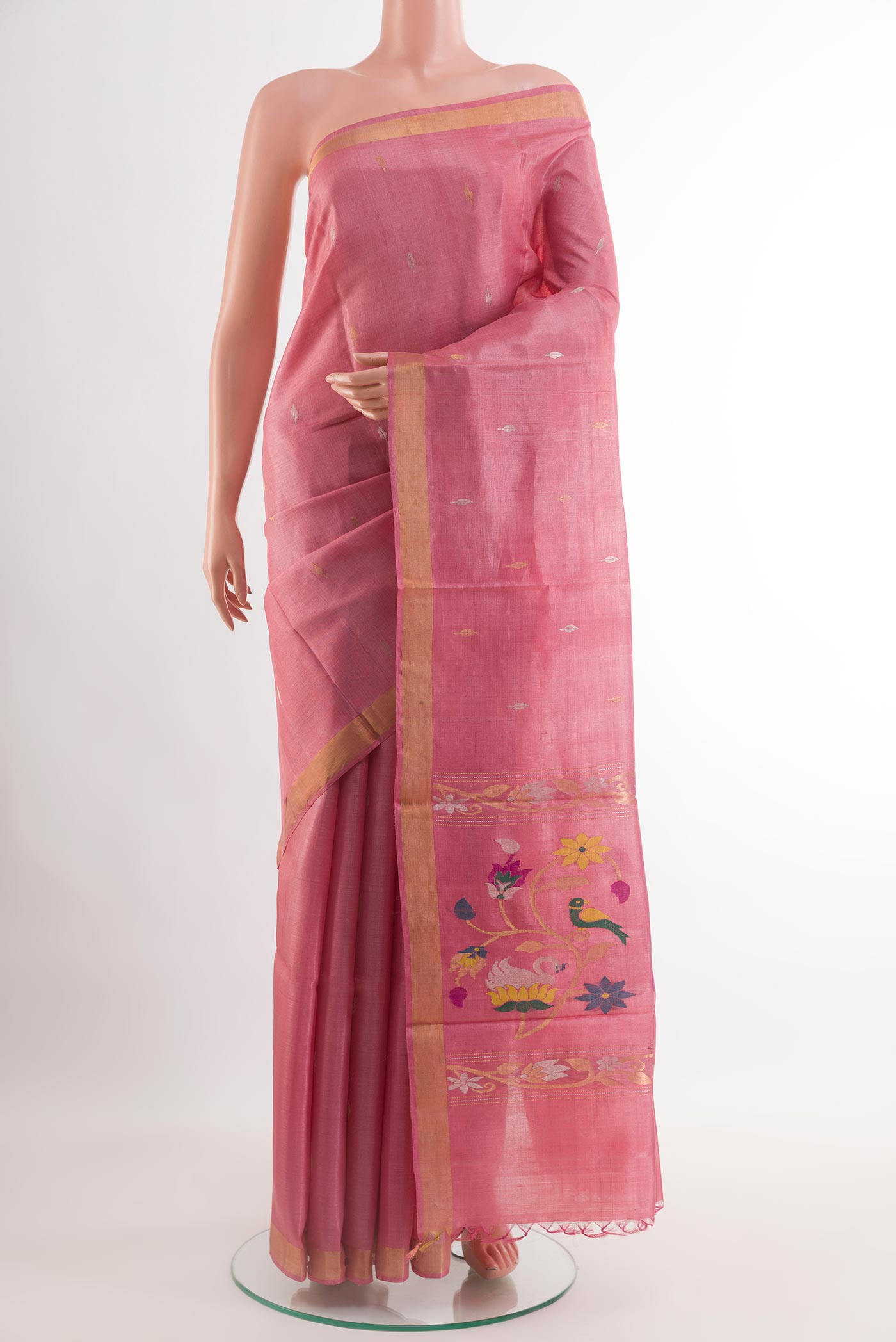Pink Tussar Saree with Zari Butta on the body and Zari Border.  displayed on a mannequin