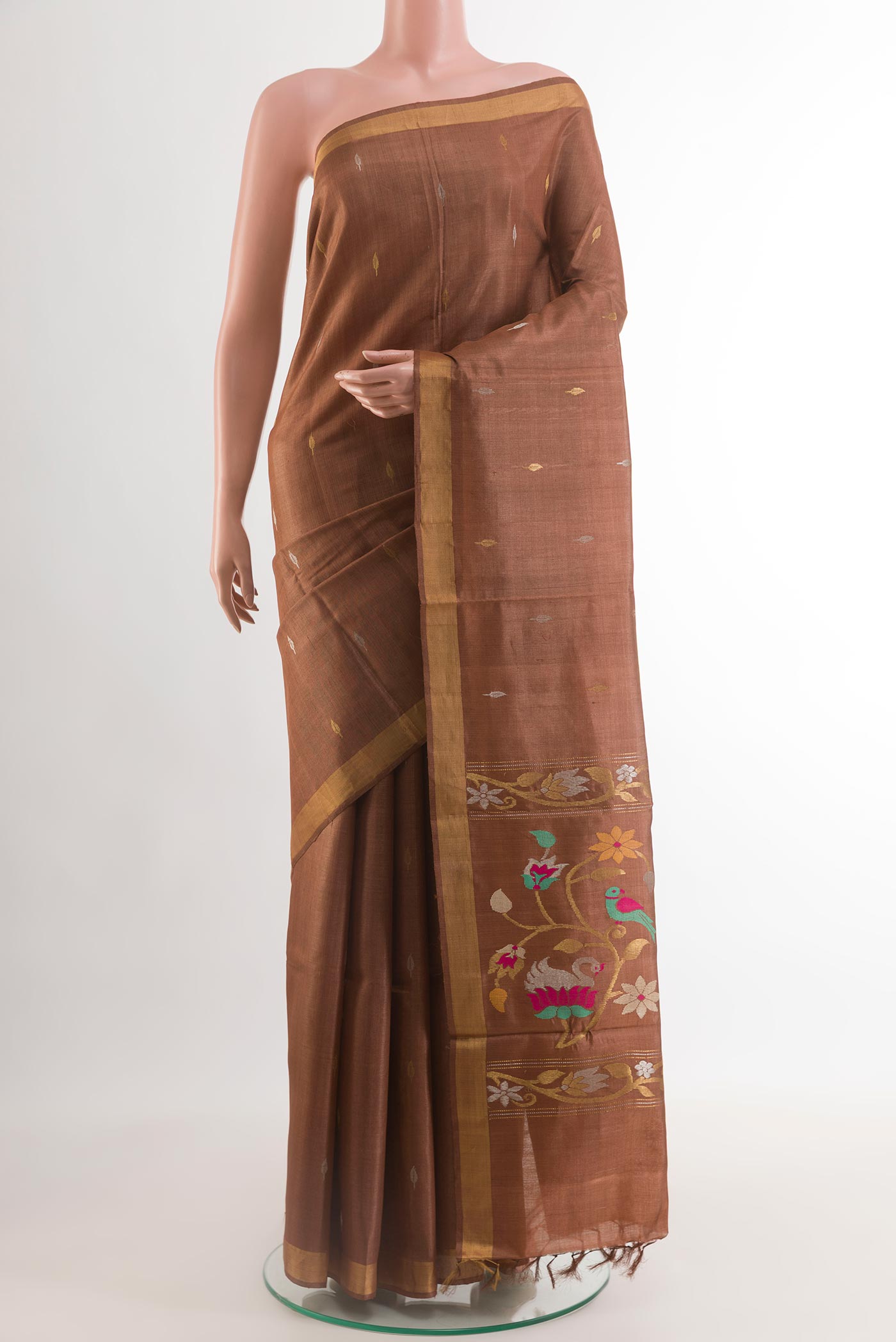 Brown Tussar Silk Saree with Zari Butta on the body and Zari Border.  displayed on a mannequin