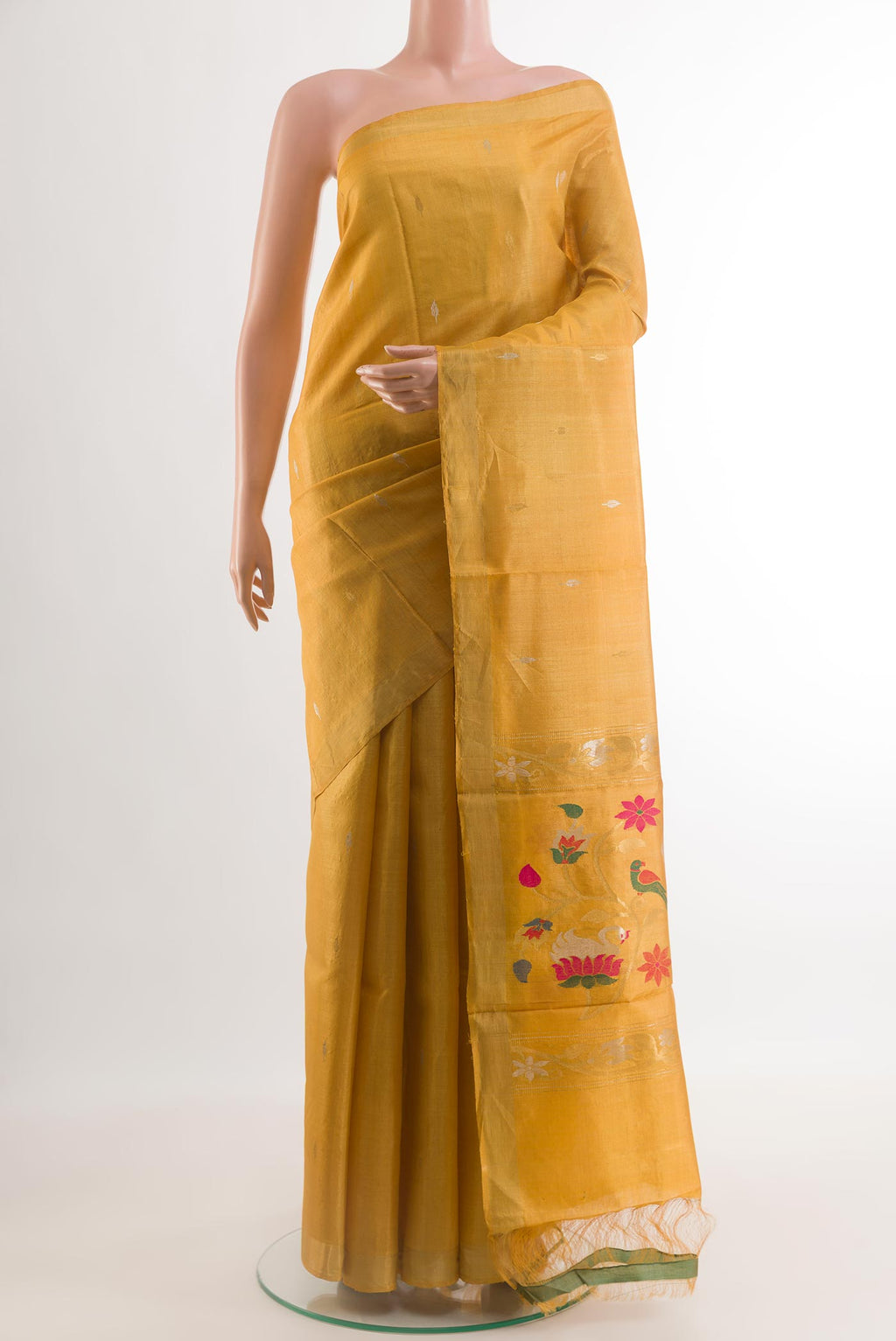 Yellow Tussar Silk Saree with Zari Butta on the body and Zari Border.  displayed on a mannequin