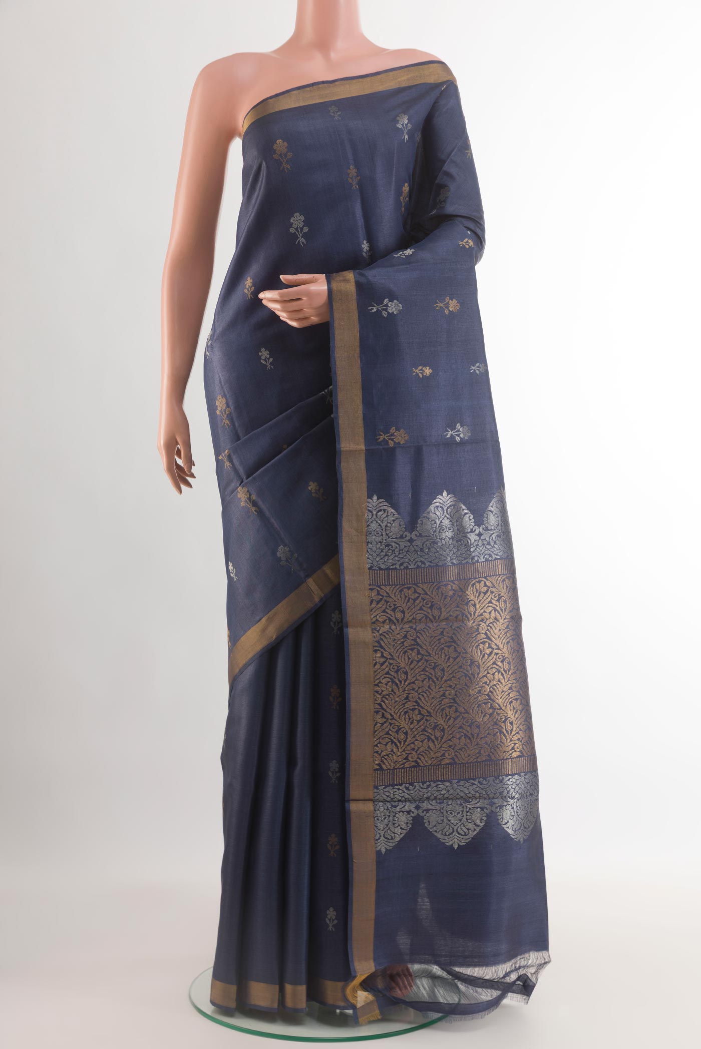 Blue Tussar Silk Saree with Zari Butta on the body and Zari Border.  displayed on a mannequin