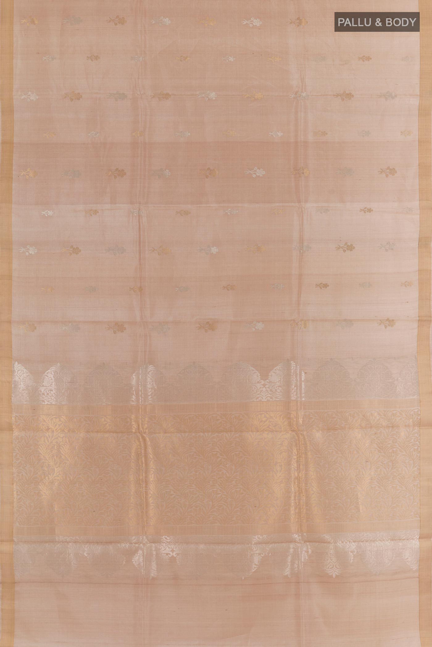 Flat view of Beige Tussar Silk Saree with Zari Butta on the body and Zari Border. 
