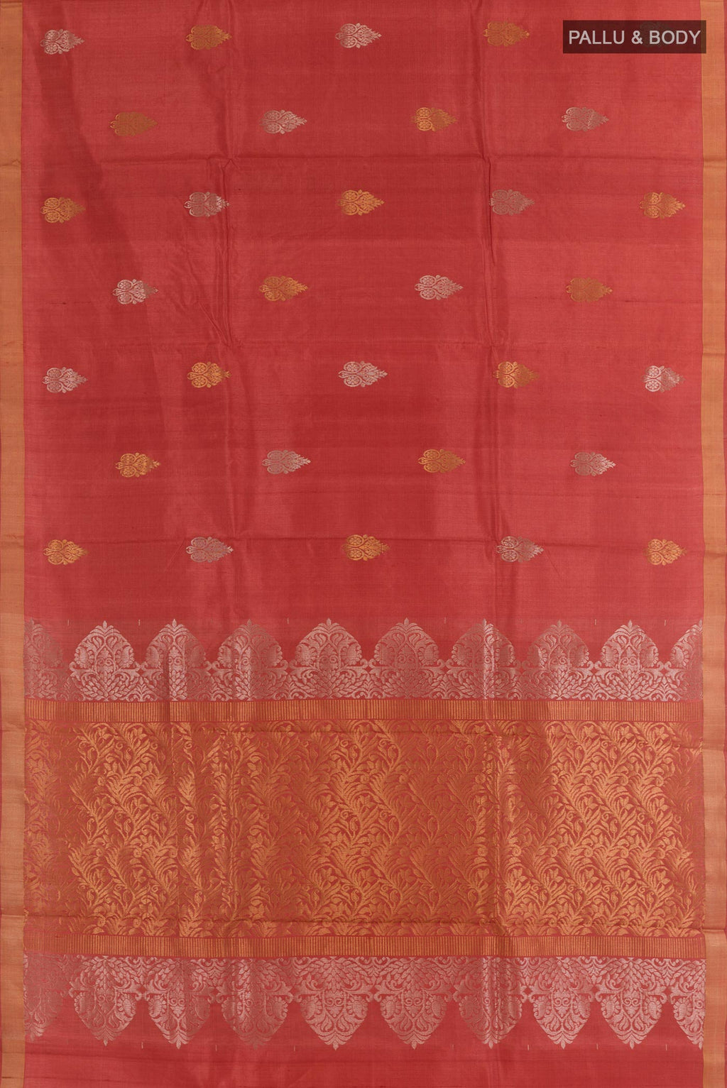 Flat view of Rust Tussar Silk Saree with Zari Butta on the body and Zari Border. 