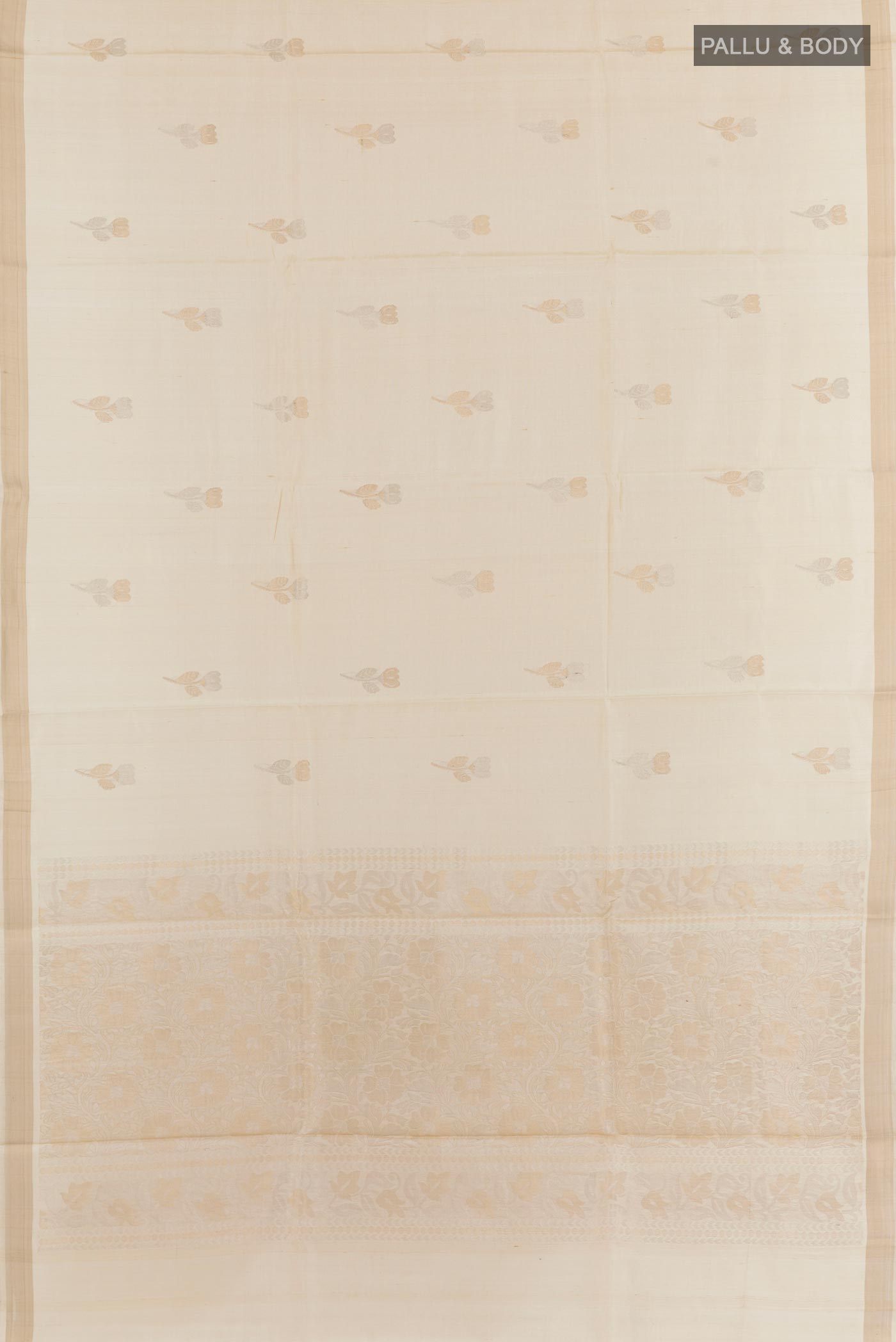 Flat view of Off White Tussar Silk Saree with Zari Butta on the body and Zari Border. 