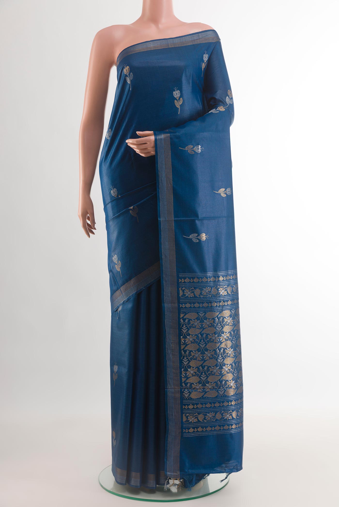 Blue Tussar Silk Saree with Zari Butta on the body and Zari Border.  displayed on a mannequin
