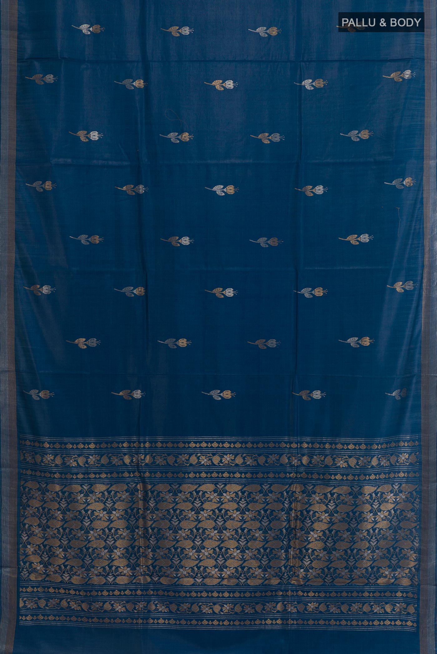 Flat view of Blue Tussar Silk Saree with Zari Butta on the body and Zari Border. 