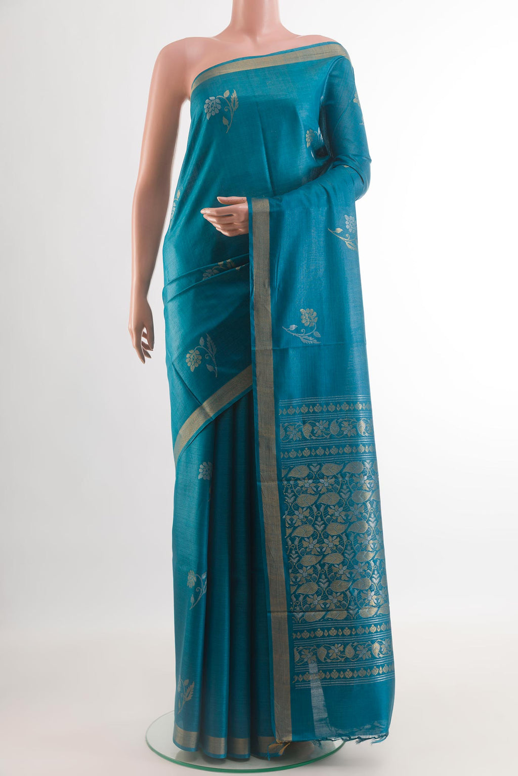 Blue Tussar Silk Saree with Zari Butta on the body and Zari Border.  displayed on a mannequin