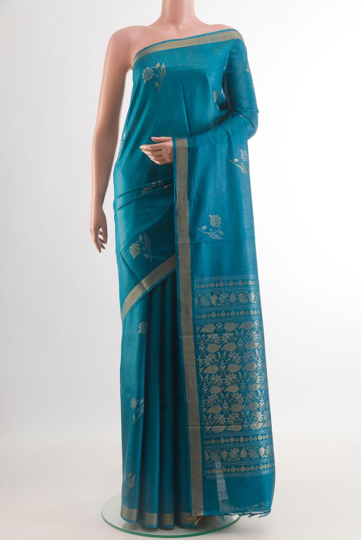 Blue Tussar Silk Saree with Zari Butta on the body and Zari Border.  displayed on a mannequin