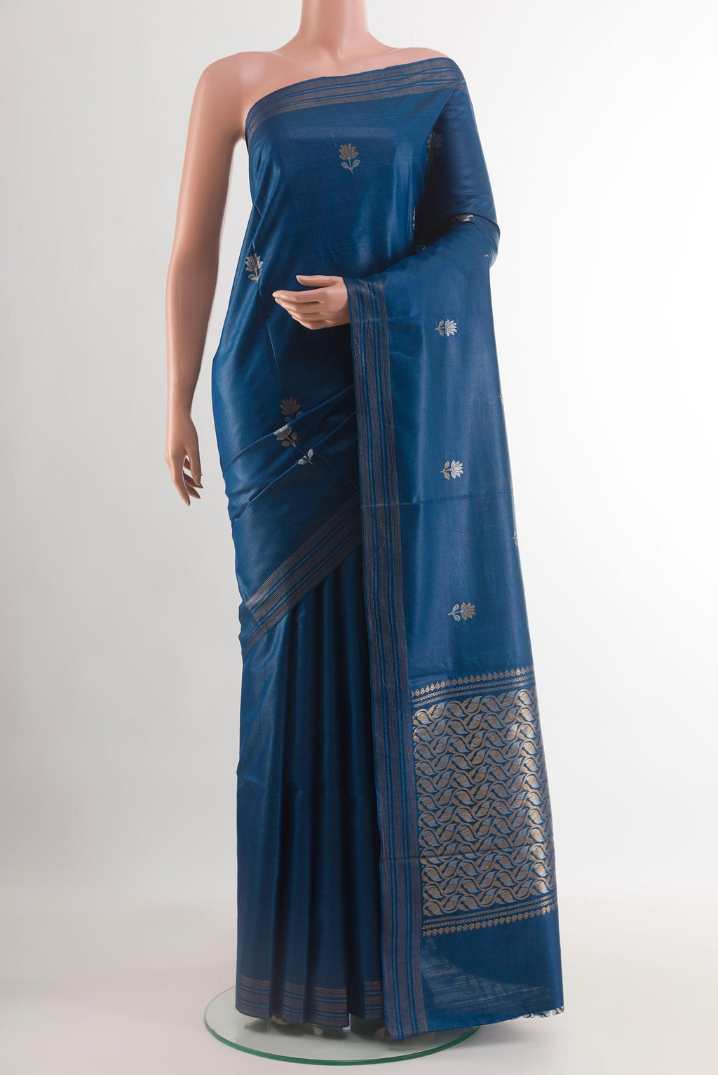 Blue Tussar Silk Saree with Zari Butta on the body and Zari Border.  displayed on a mannequin