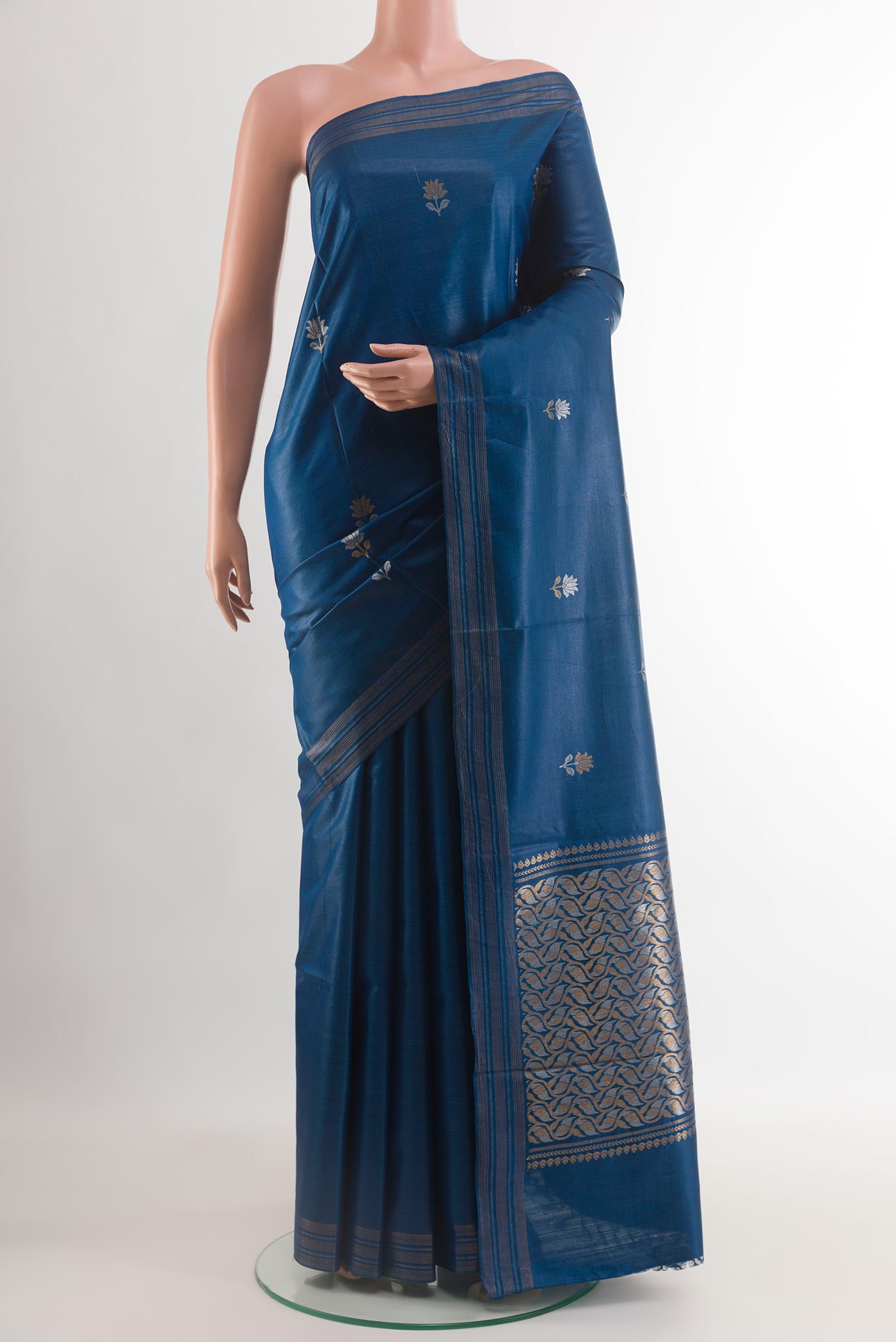 Blue Tussar Silk Saree with Zari Butta on the body and Zari Border.  displayed on a mannequin