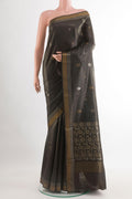 Black Tussar Silk Saree with Zari Butta on the body and Zari Border.  displayed on a mannequin