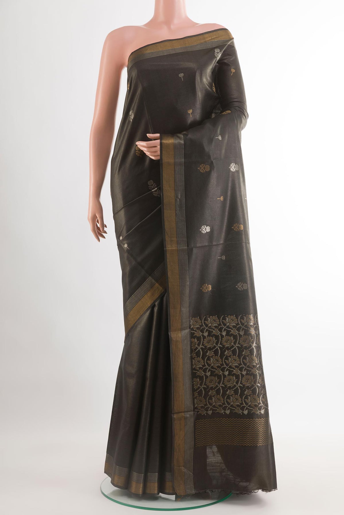 Black Tussar Silk Saree with Zari Butta on the body and Zari Border.  displayed on a mannequin