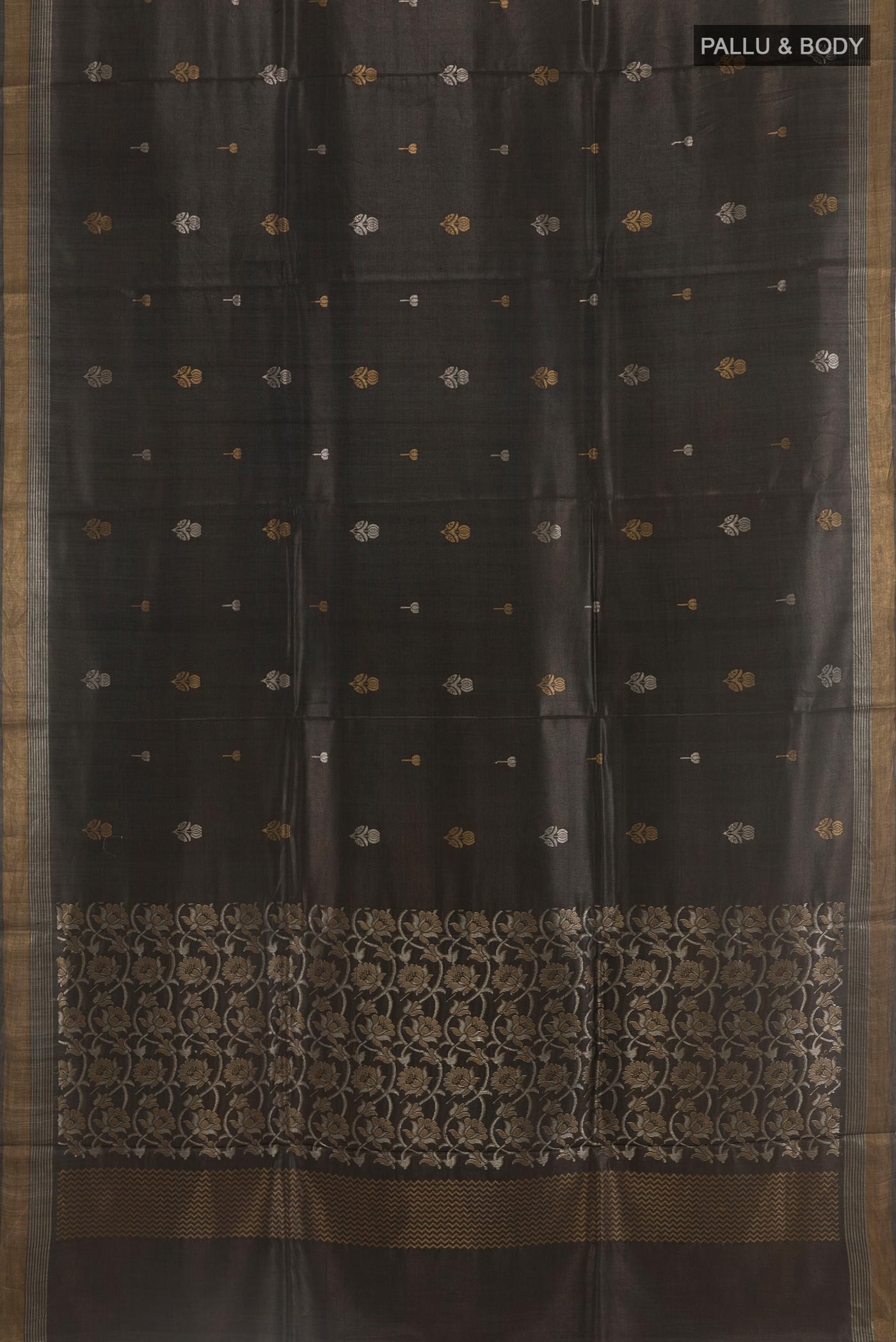 Flat view of Black Tussar Silk Saree with Zari Butta on the body and Zari Border. 