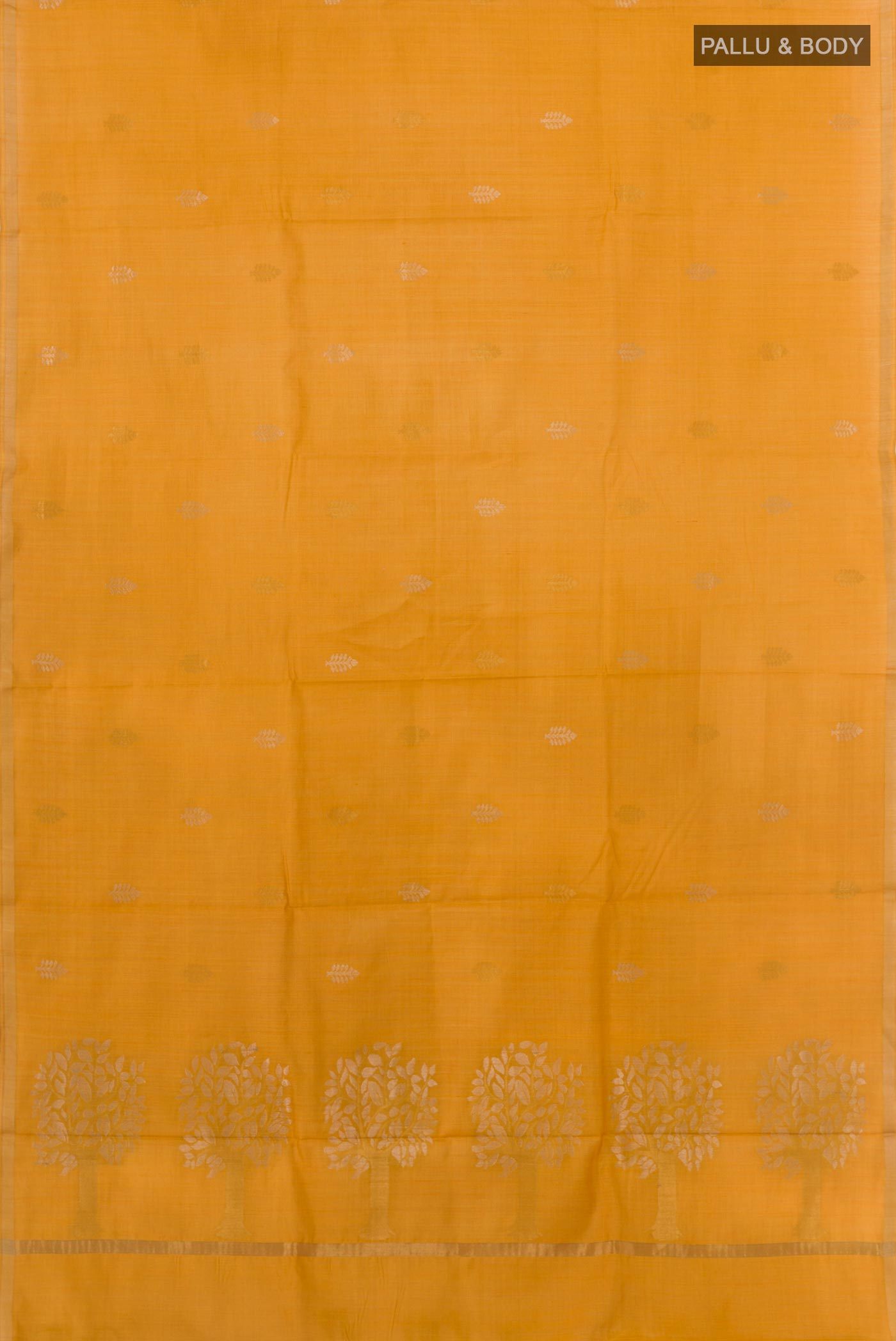Flat view of Yellow Tussar Saree with Printed design on the body and Zari Border. 