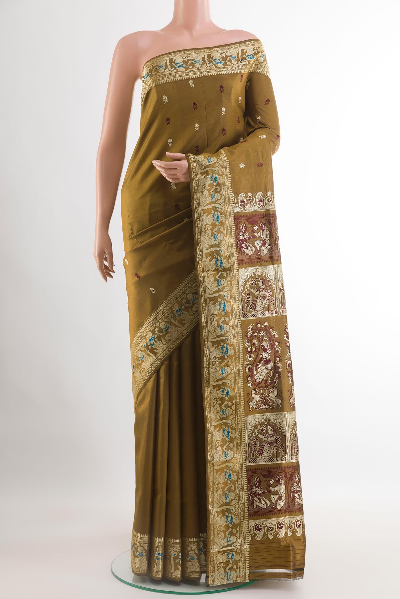 Mehandi Green Baluchari Silk Saree with Zari Butta on the body and Zari Border.  displayed on a mannequin
