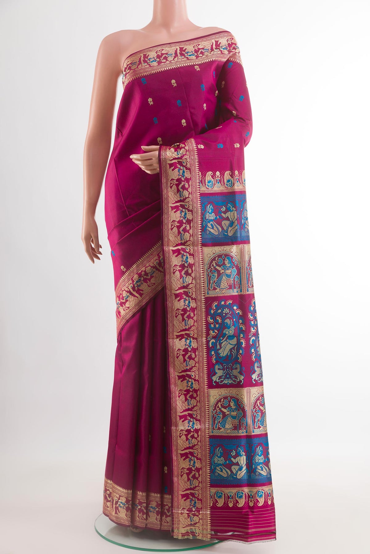 Purple Baluchari Silk Saree with Zari Butta on the body and Zari Border.  displayed on a mannequin