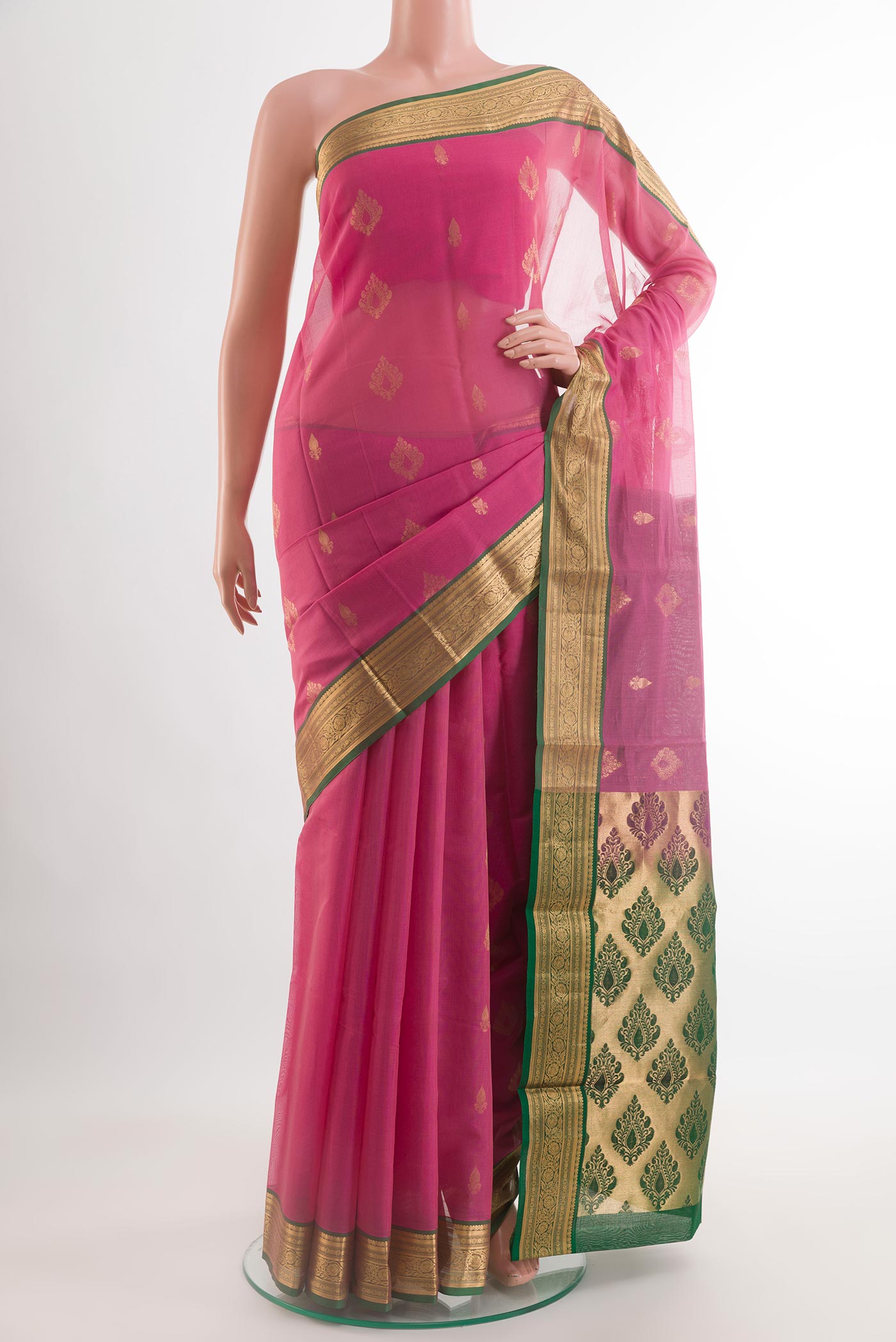 Pink Blended Kora Cotton Saree with Zari Butta on the body and Zari Border.  displayed on a mannequin