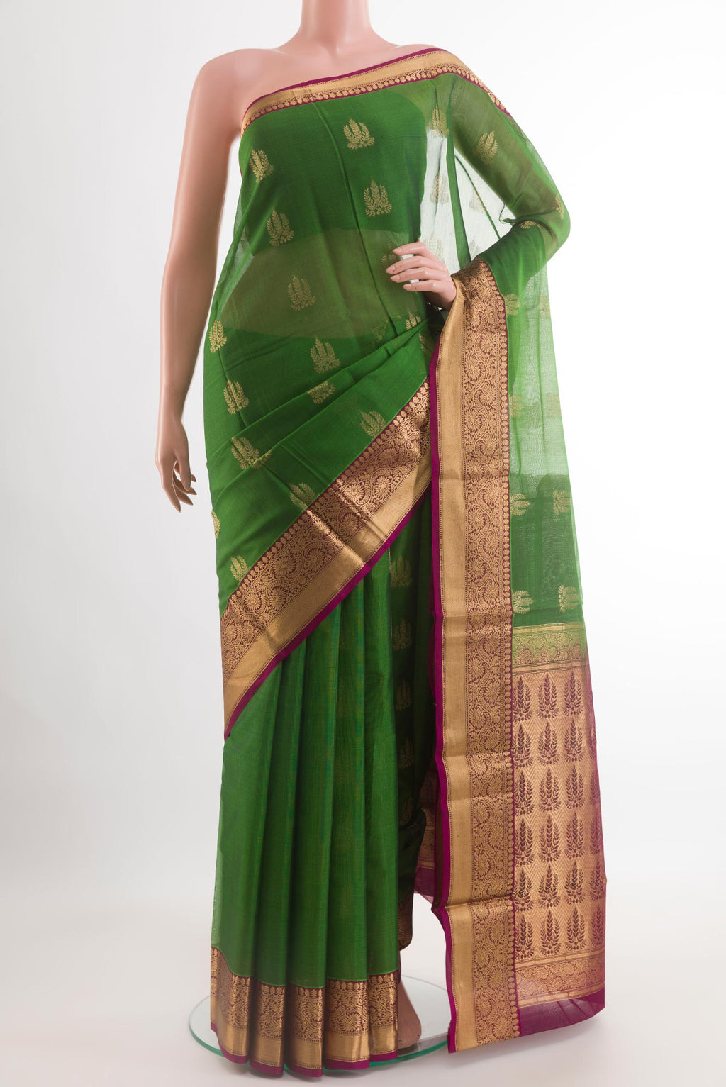 Green Blended Kora Cotton Saree with Zari Butta on the body and Zari Border.  displayed on a mannequin