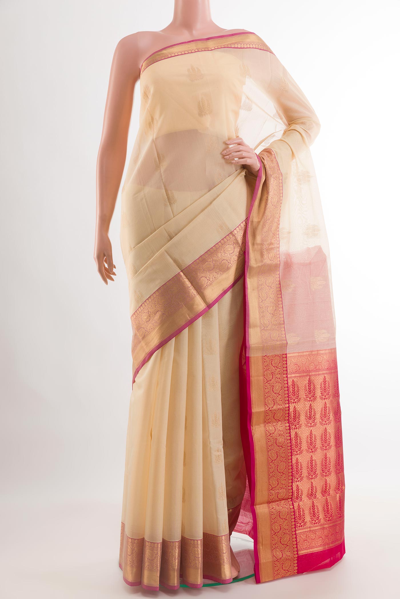 Beige Blended Kora Cotton Saree with Zari Butta on the body and Zari Border.  displayed on a mannequin