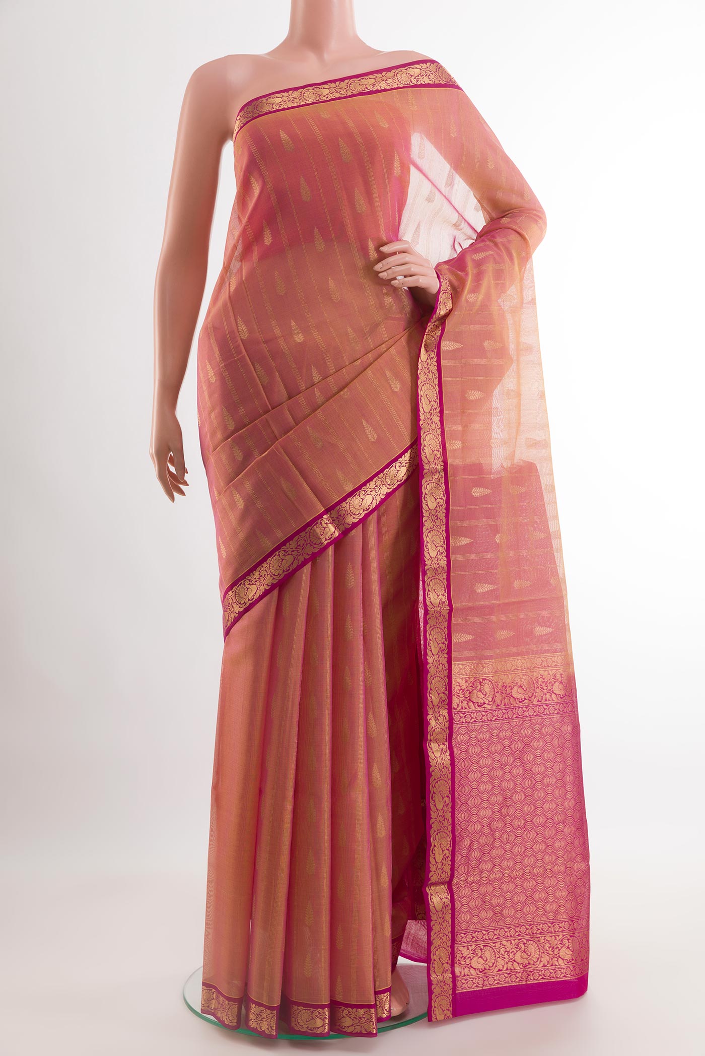 Peach Blended Kora Cotton Saree with Zari Butta on the body and Zari Border.  displayed on a mannequin