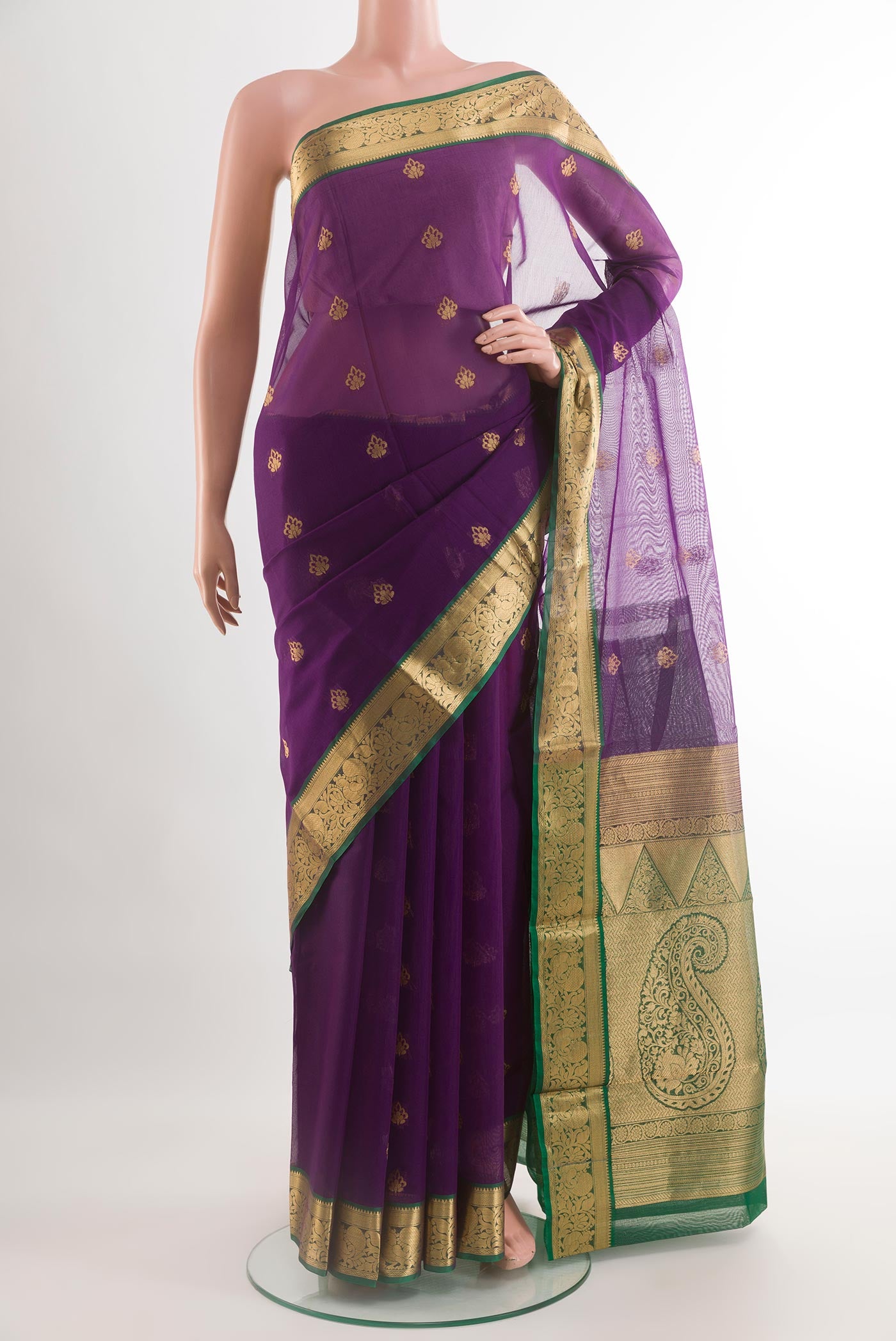 Violet Silk Cotton Saree with Zari Butta on the body and Zari Border.  displayed on a mannequin