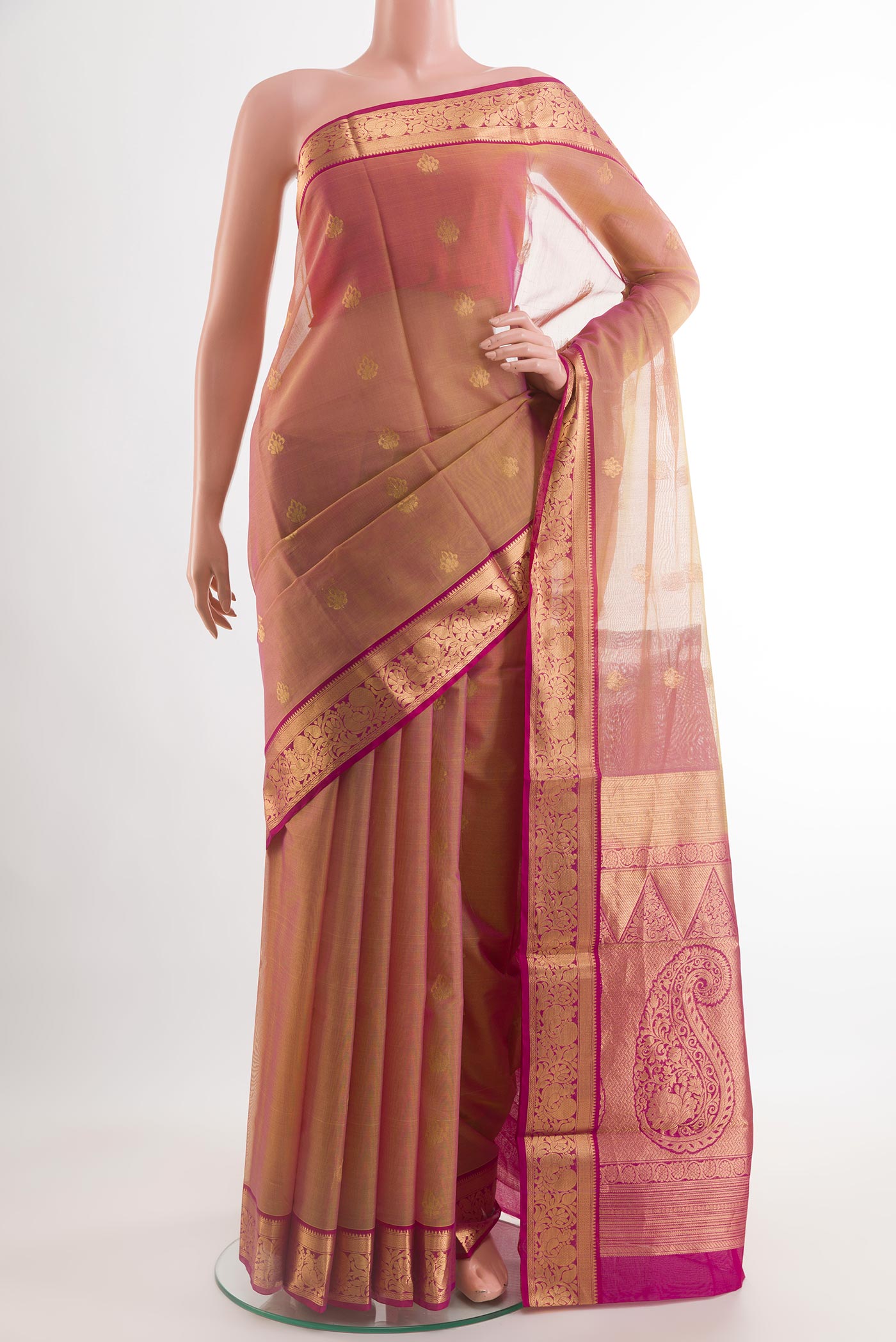 Peach Blended Kora Cotton Saree with Zari Butta on the body and Zari Border.  displayed on a mannequin