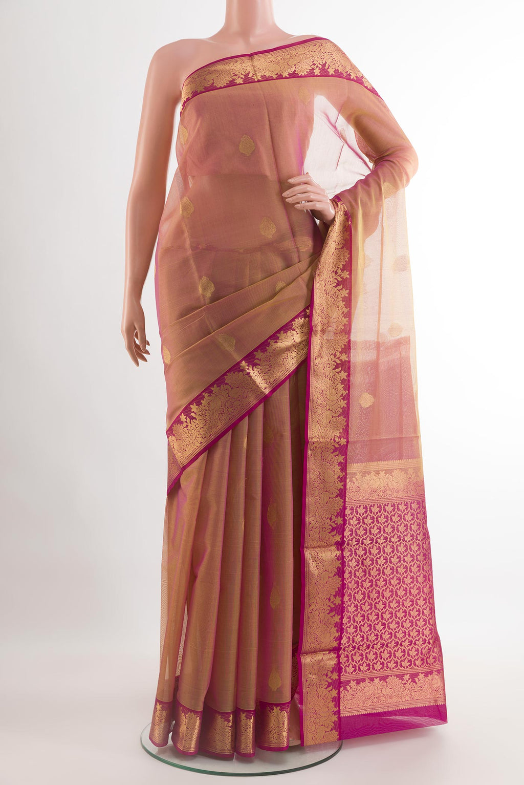 Rose Gold Silk Cotton Saree with Zari Butta on the body and Zari Border.  displayed on a mannequin