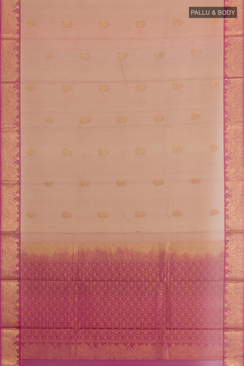 Flat view of Rose Gold Silk Cotton Saree with Zari Butta on the body and Zari Border. 