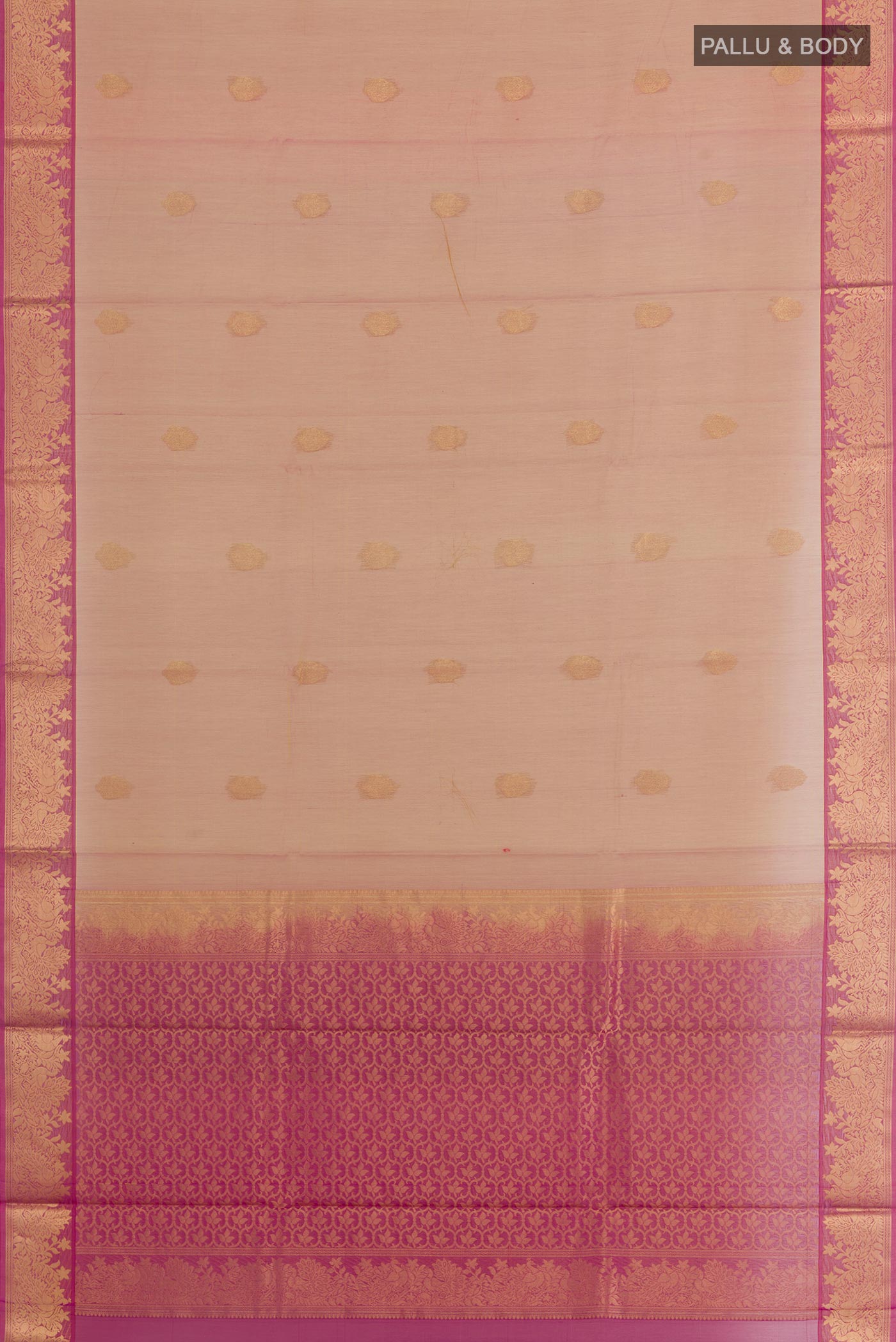 Flat view of Rose Gold Silk Cotton Saree with Zari Butta on the body and Zari Border. 