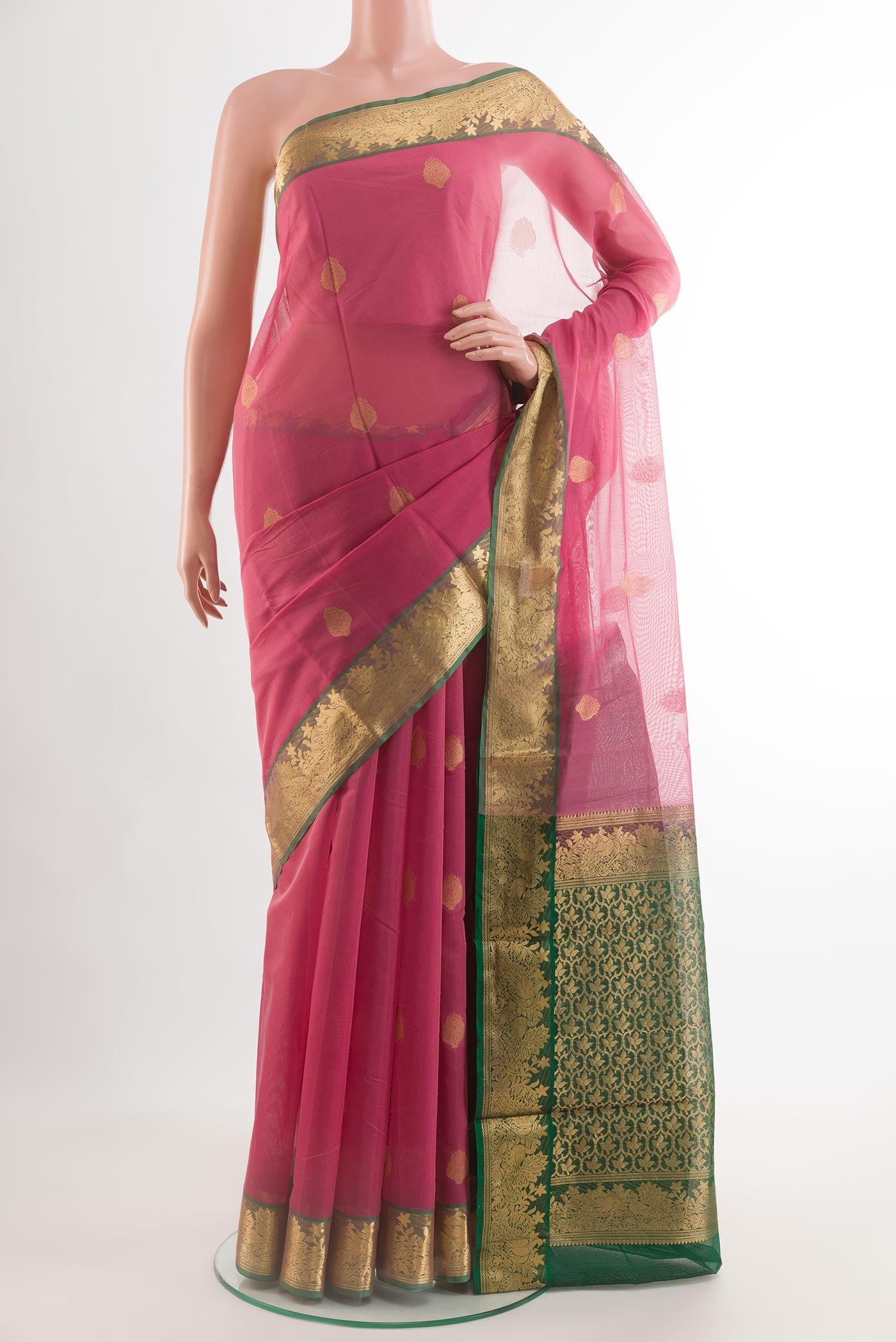 Pink Silk Cotton Saree with Zari Butta on the body and Zari Border.  displayed on a mannequin