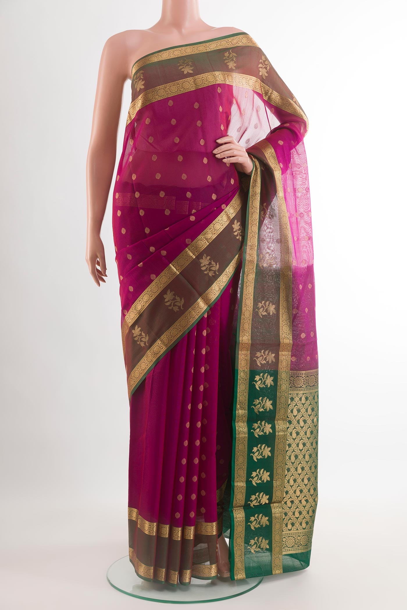 Magenta Silk Cotton Saree with Zari Butta on the body and Zari Border.  displayed on a mannequin