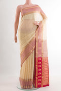 Cream Silk Cotton Saree with Zari Butta on the body and Zari Border.  displayed on a mannequin