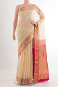 Cream Silk Cotton Saree with Zari Butta on the body and Zari Border.  displayed on a mannequin