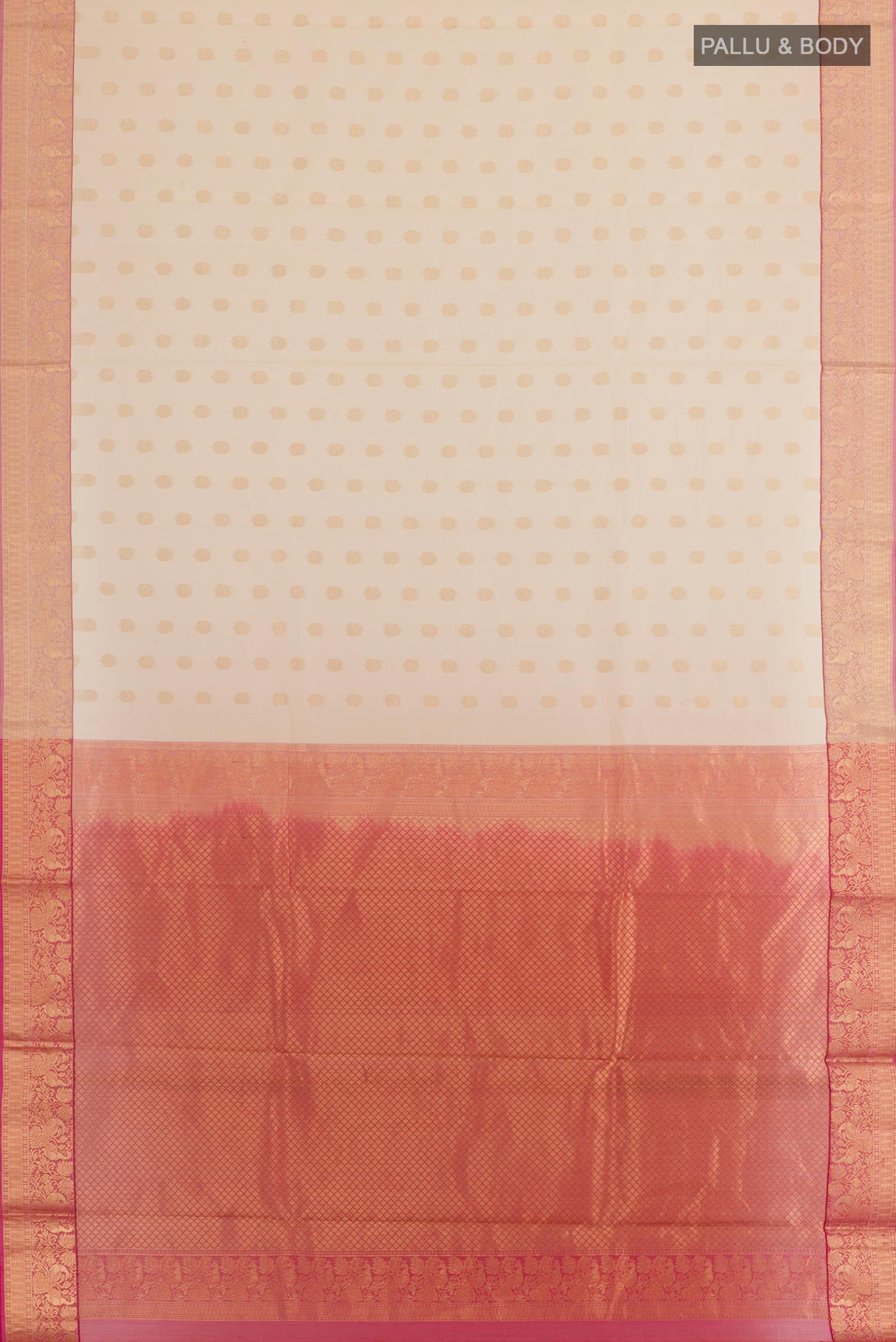 Flat view of Cream Silk Cotton Saree with Zari Butta on the body and Zari Border. 