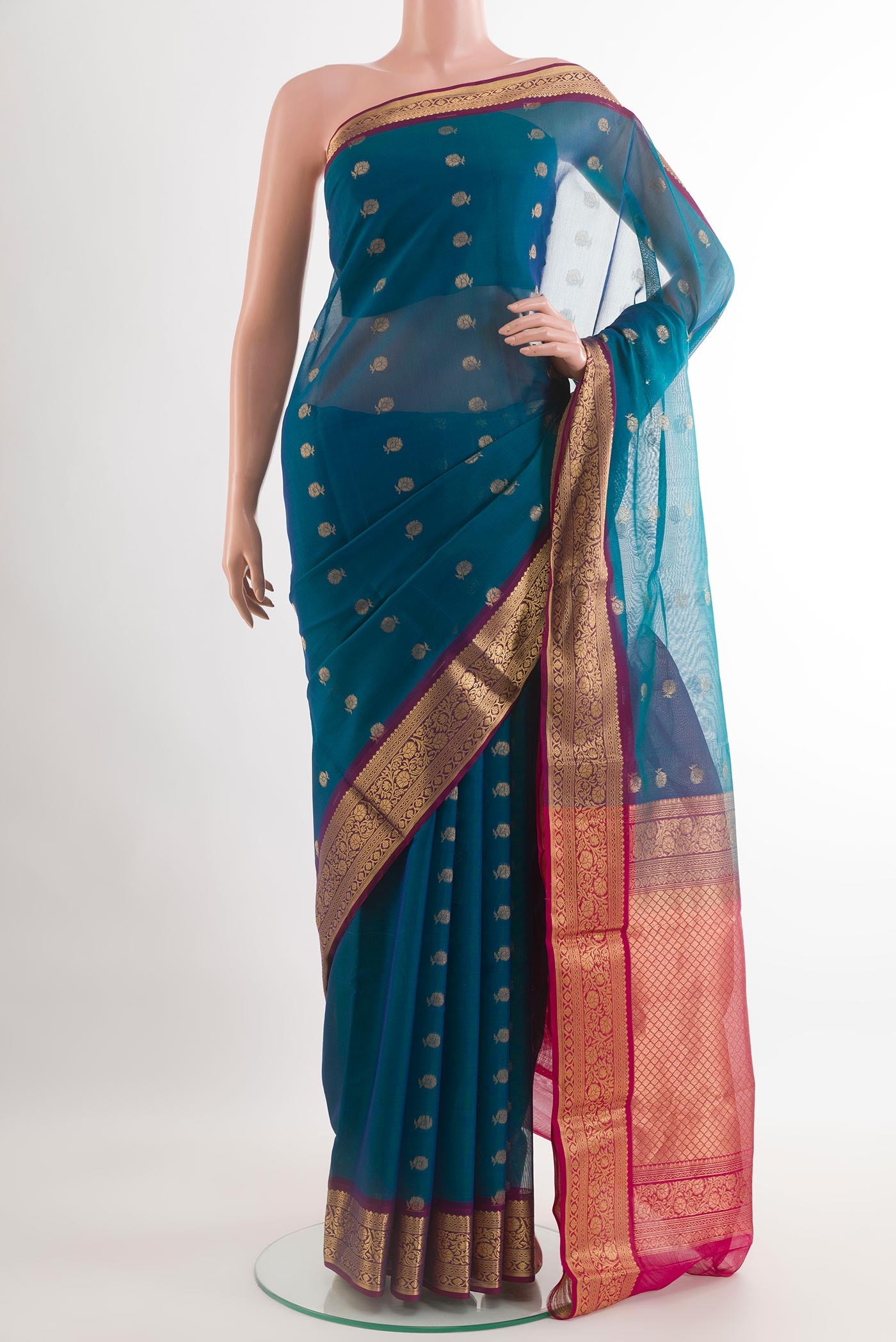 Blue Silk Cotton Saree with Zari Butta on the body and Zari Border.  displayed on a mannequin