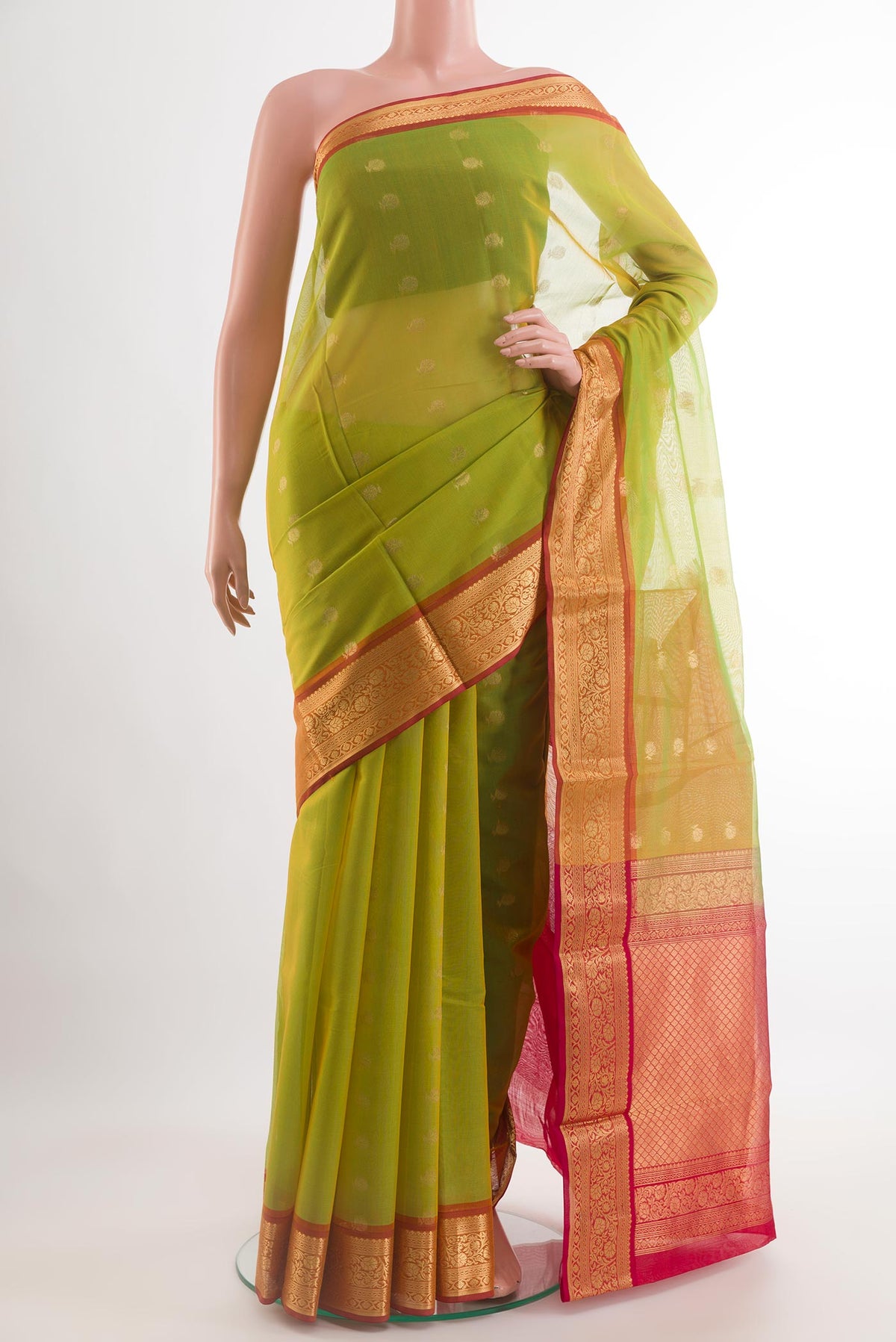 Light Green Blended Kora Cotton Saree with Zari Butta on the body and Zari Border.  displayed on a mannequin