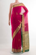 Pink Silk Cotton Saree with Zari Butta on the body and Zari Border.  displayed on a mannequin