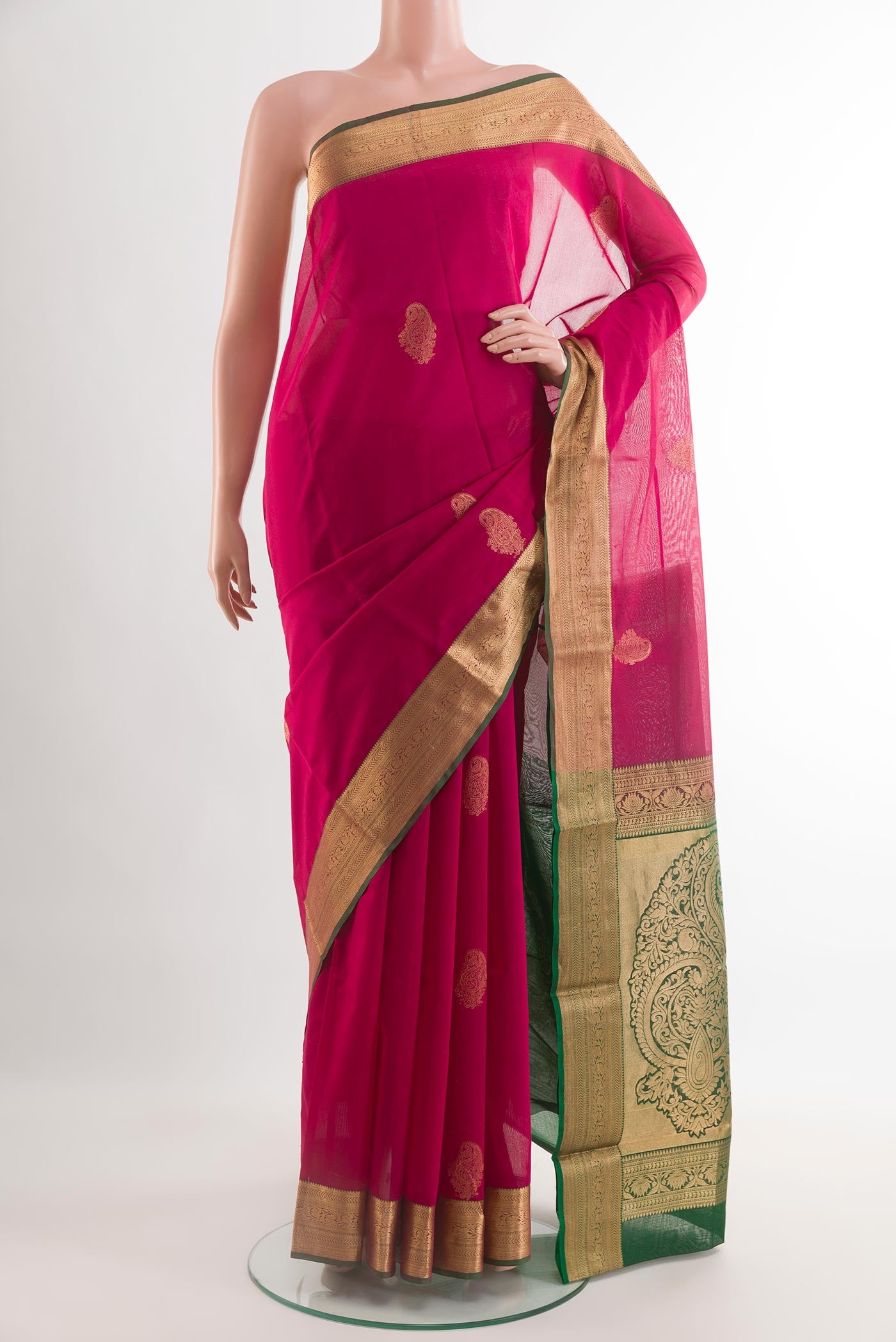 Pink Silk Cotton Saree with Zari Butta on the body and Zari Border.  displayed on a mannequin