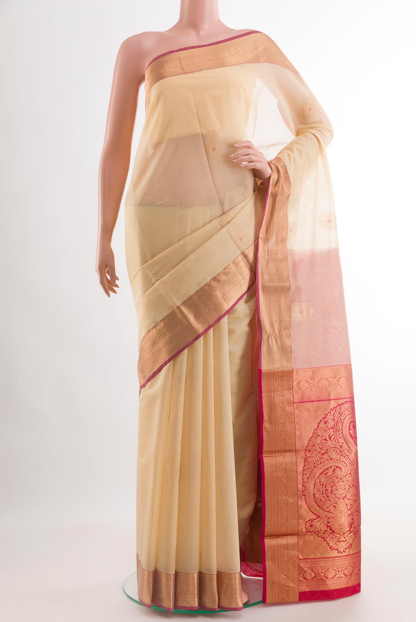 Beige Blended Kora Cotton Saree with Zari Butta on the body and Zari Border.  displayed on a mannequin
