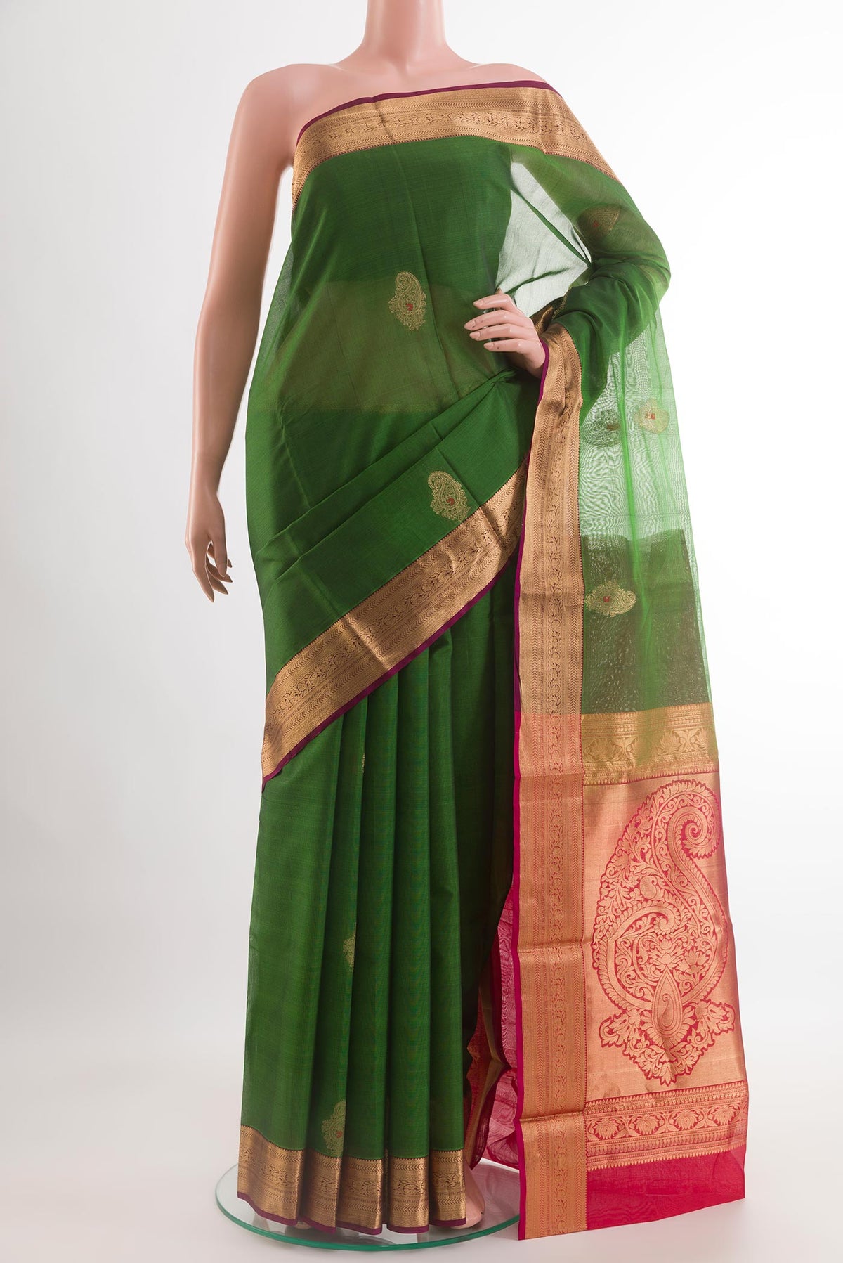 Green Blended Kora Cotton Saree with Zari Butta on the body and Zari Border.  displayed on a mannequin