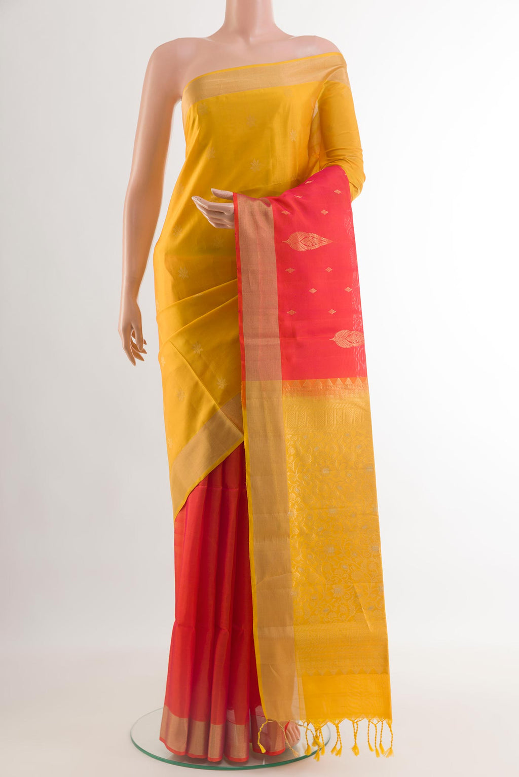 Multi Color Soft Silk Saree with Zari Butta on the body and Zari Border.  displayed on a mannequin