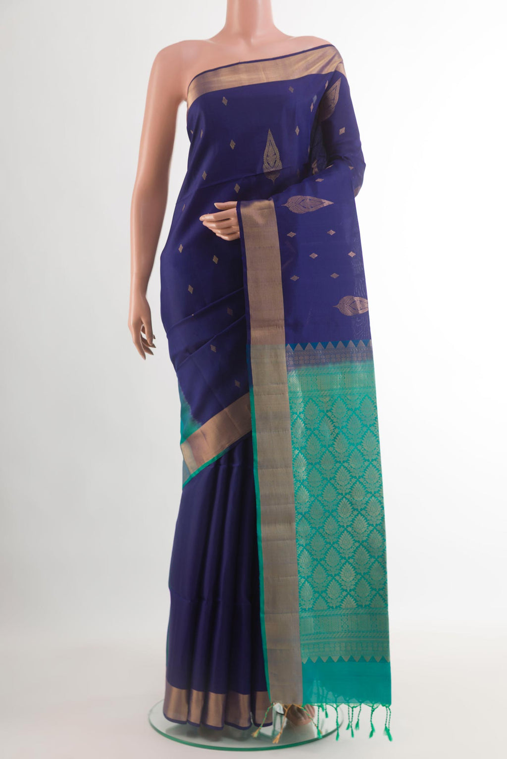 Blue Soft Silk Saree with Zari Butta on the body and Zari Border.  displayed on a mannequin