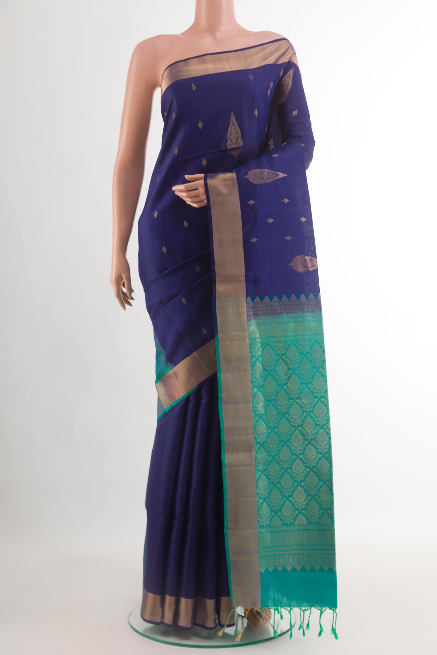 Blue Soft Silk Saree with Zari Butta on the body and Zari Border.  displayed on a mannequin