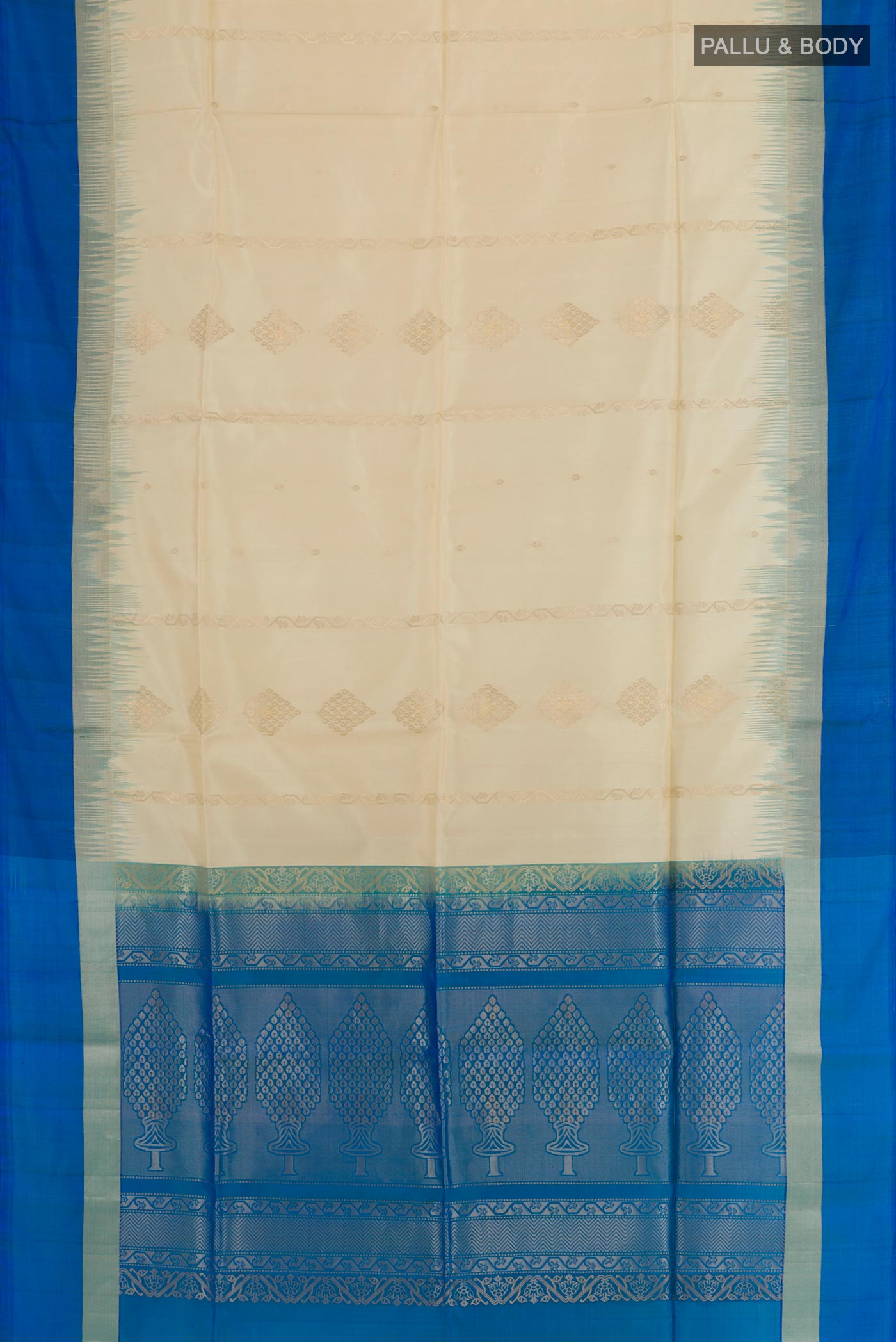 Flat view of Cream Soft Silk Saree with Zari Butta on the body and Zari Border. 